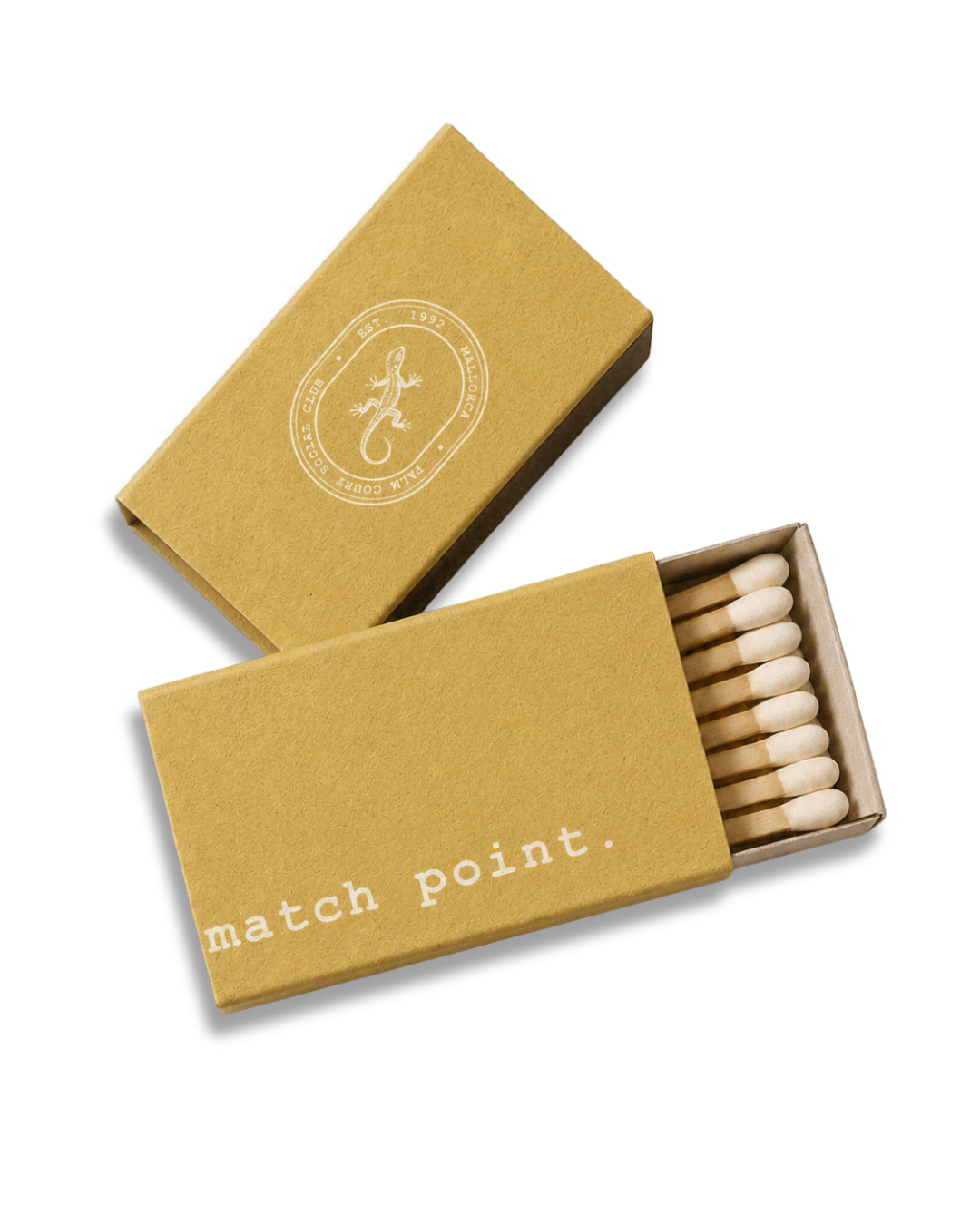 A matchbox with the words 'match point.' printed on the side, partially open to reveal wooden matches inside, with a second closed matchbox featuring an lizard and circular logo on the top.
