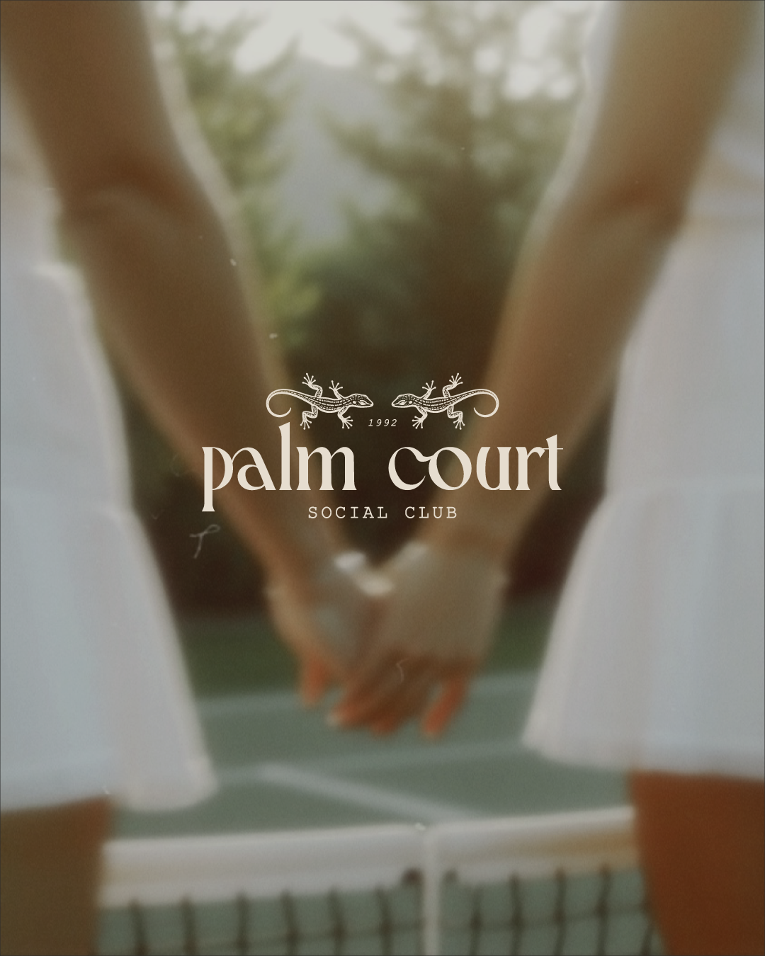A person holding a small lizard with a logo that reads 'palm court SOCIAL CLUB 1992' over the image.