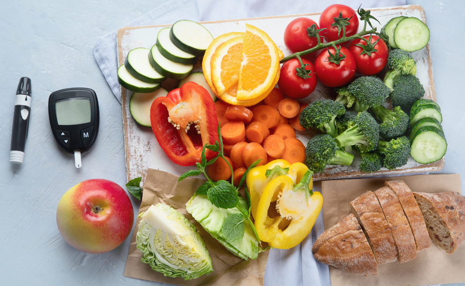 Fruits and vegetables next to diabetes testing equipment