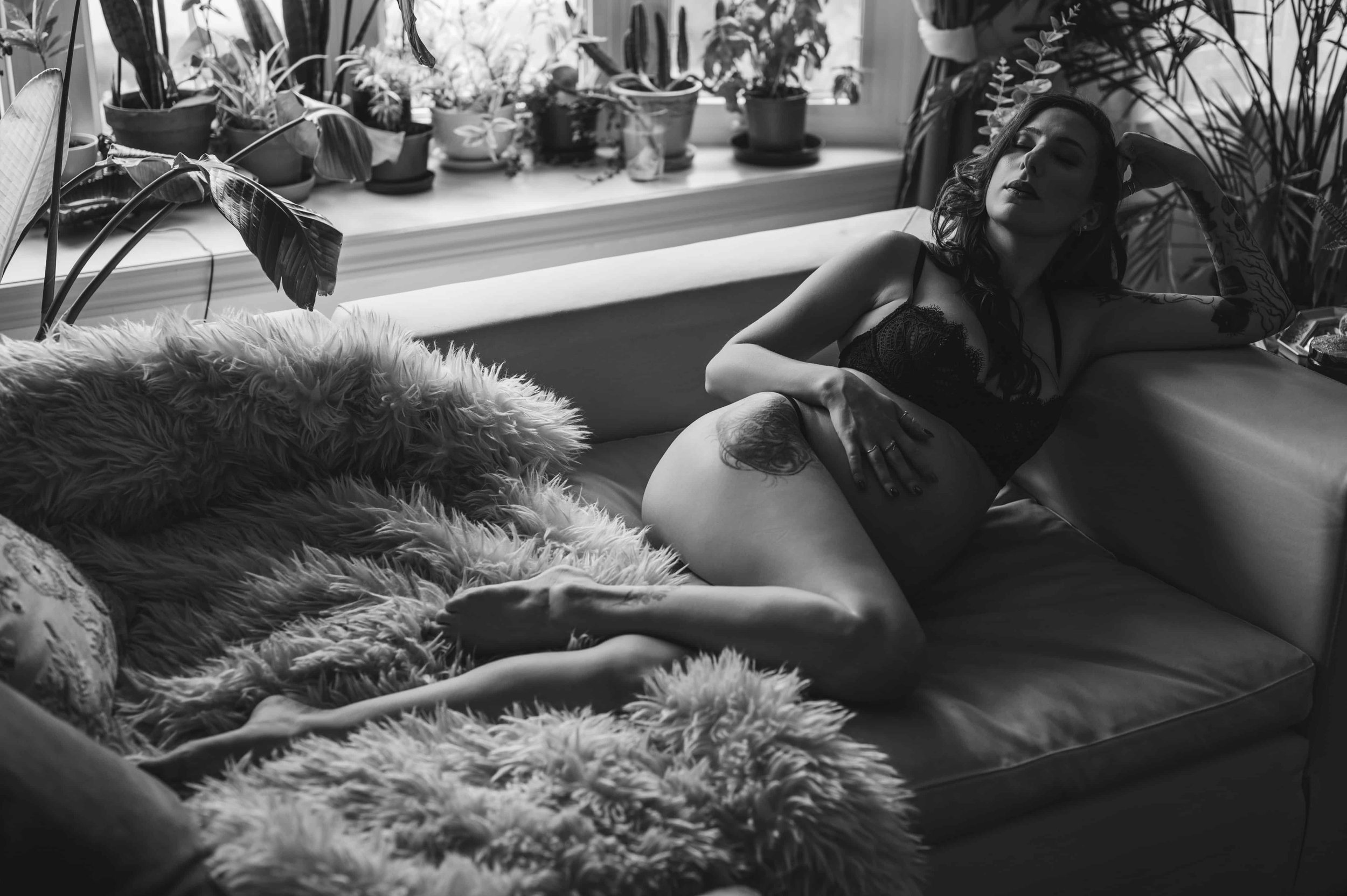 Timeless maternity portrait celebrating pregnancy in a calm, intimate studio