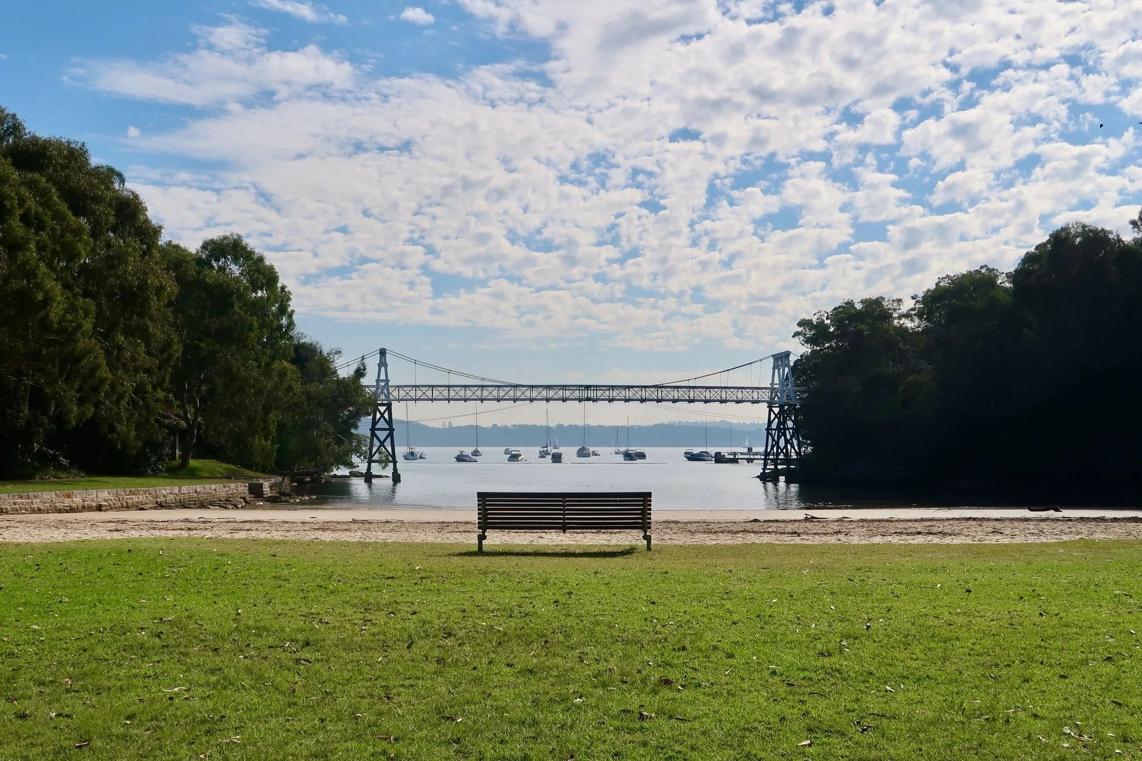 View from Parsley Bay Reserve to Parsley Bay Bridge and sailing boats beyond