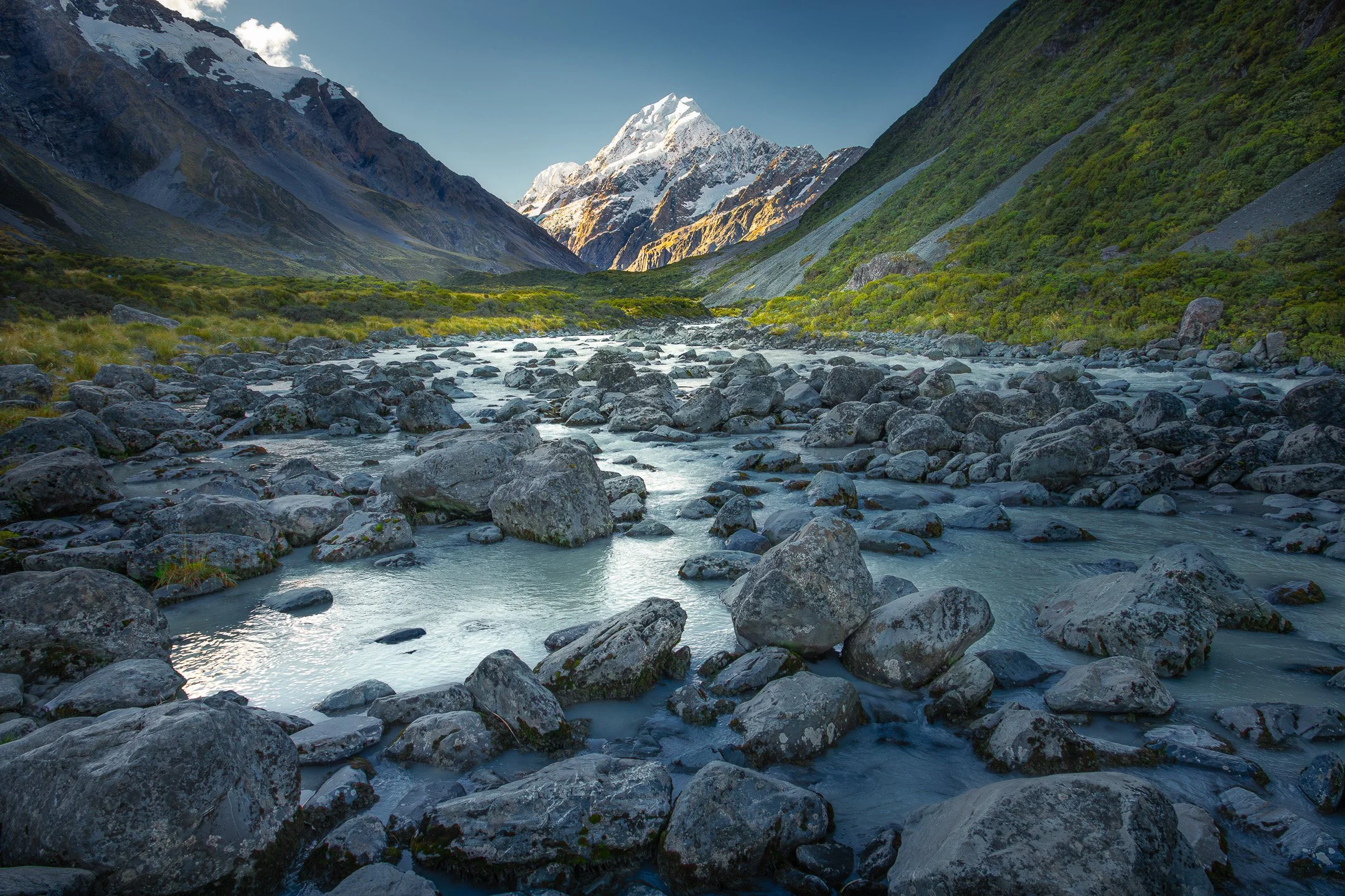 Milky blue Hooker River winds through a glacial valley beneath Aoraki/Mount Cook, Canterbury, New Zealand