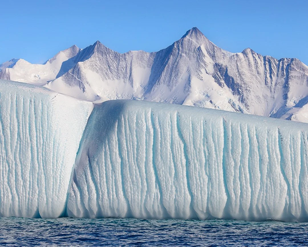 Blue Stillness &ndash; Ross Sea Region, Antarctica.

Antarctica on clear, still days: calm, expansive and reduced to its purest elements of blue and white, where ice and sky meet without interruption.

Images:
1)	Lines of Descent - Cape Hallett
2)	Mo