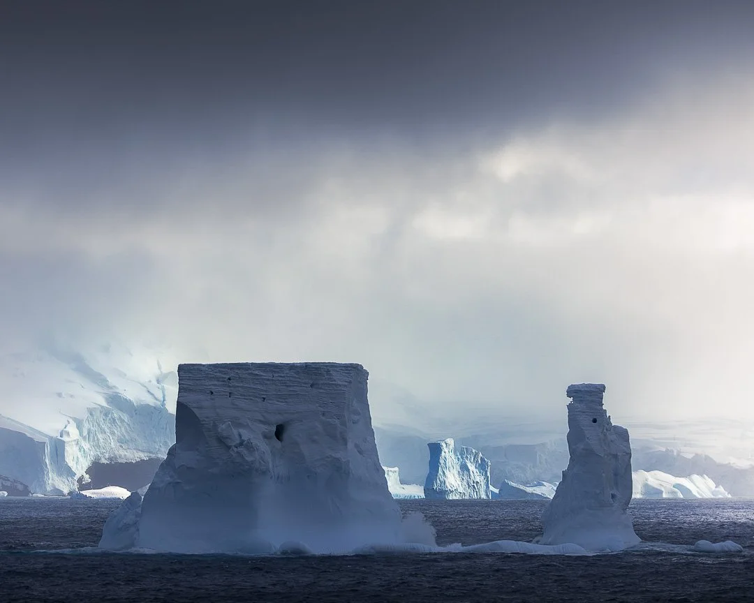 Something is coming.

The Balleny Islands sit at one of the most extraordinary geographic boundaries on Earth &mdash; the Antarctic Circle runs directly through the archipelago. To pass through them is to cross, literally and physically, into the tru