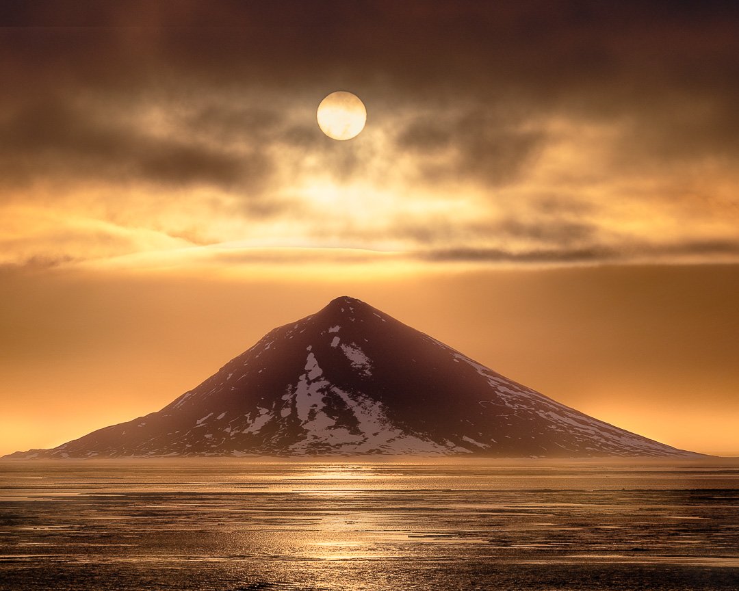 Solar Alignment | McMurdo Sound, Antarctica.

There is a strange, quiet magic in the Ross Sea&mdash;a place where the coldest continent on Earth suddenly feels glowing and gold.

This shot, "Solar Alignment," captures a rare moment in McMur