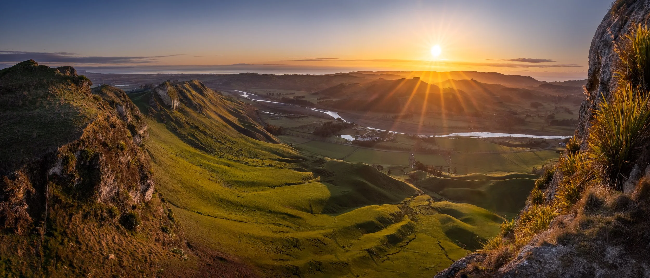 Te Mata Peak Panorama overlooking the Tukituki River valley at sunrise.