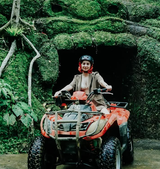 The Equipment Guide Global Editor Courtney Cunningham crossing a jungle river on a quad bike