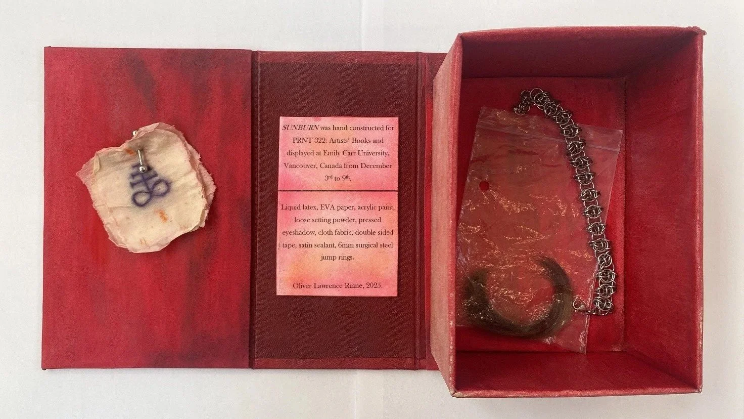'SUNBURN' Artist Book, liquid latex, EVA paper, acrylic paint, loose setting powder, pressed eyeshadow, cloth fabric, double sided tape, satin sealant, 6mm surgical steel jump rings, steel labret, human hair. 2024. 