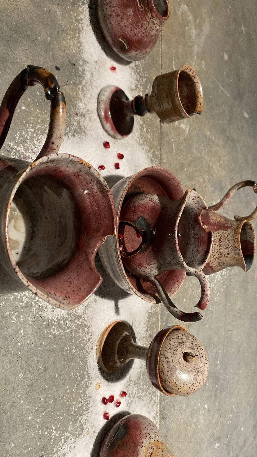 'WHAT CONSUMES YOU' Installation, cone 10 reduction. Wheel thrown and bitten. 2025.