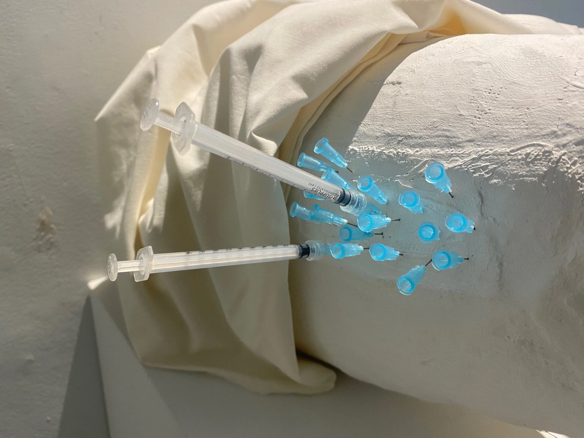 '172, Repeat'. Plaster bandages, foam paper, 1mL syringes and needles, fabric. 2024. 