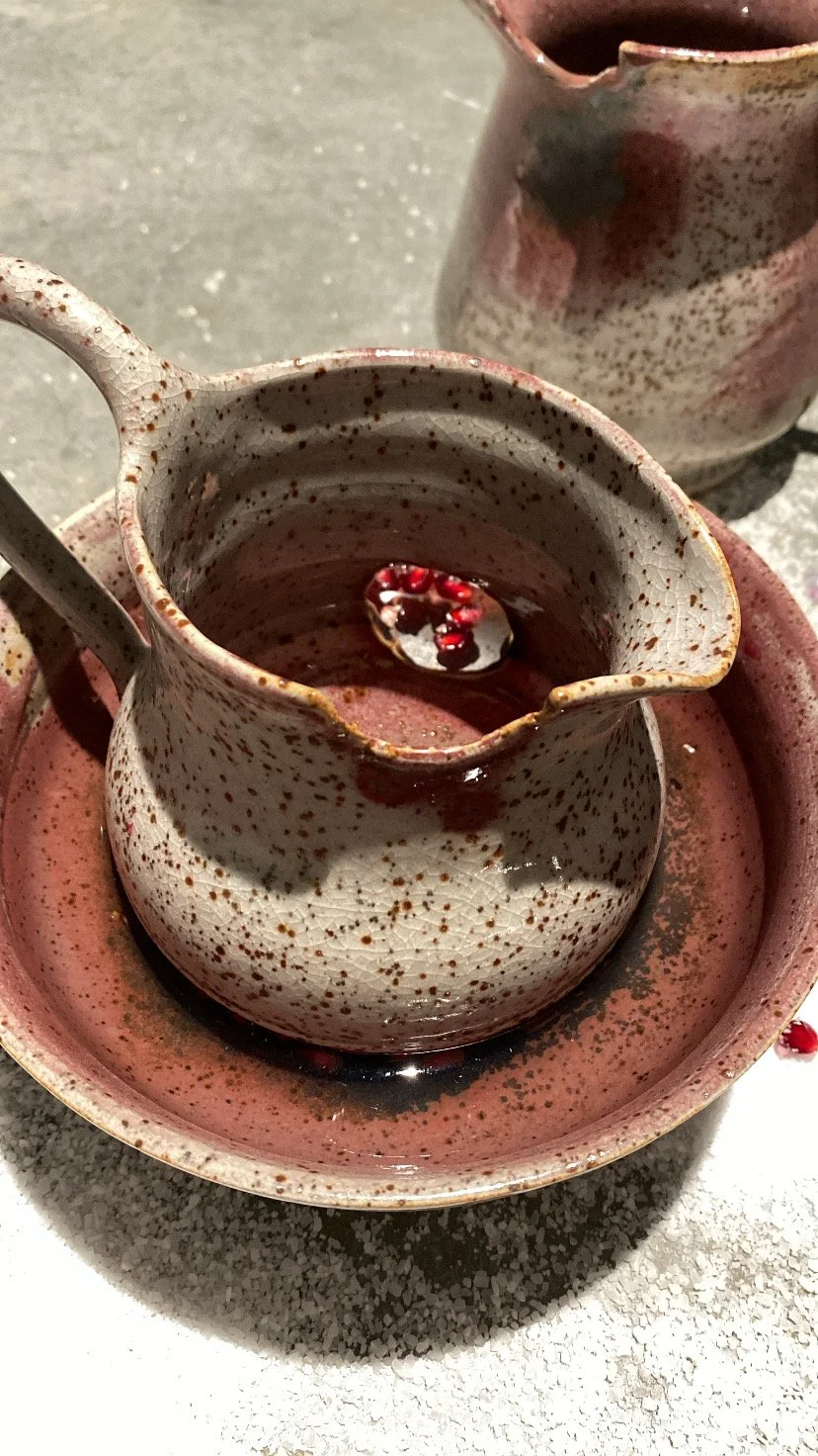 'WHAT CONSUMES YOU' Installation, cone 10 reduction. Wheel thrown and bitten. 2025.