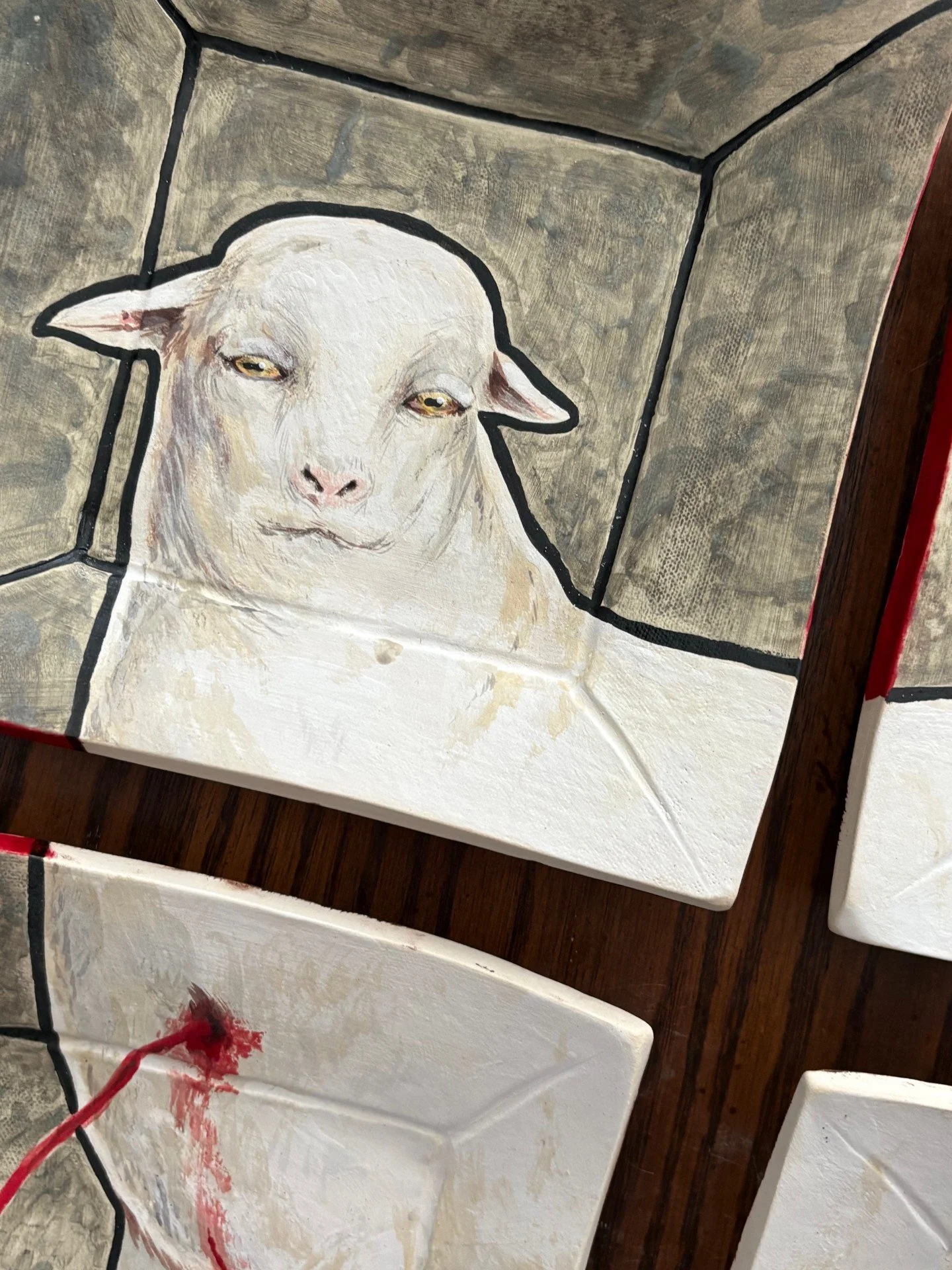 'Confession of the Lamb', underglaze, maolica overglaze. Cone 6 Oxidation. Wheel thrown and slab built table set, 2025.
