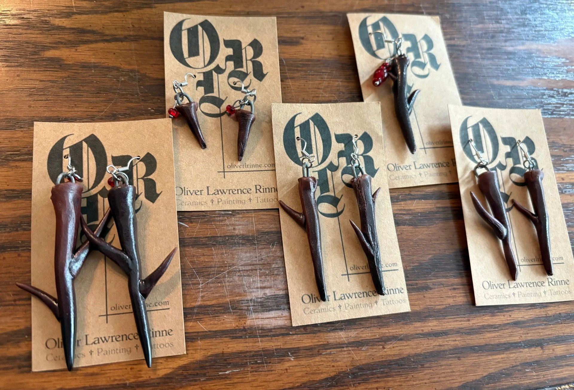 Thorn Earrings, sculpted M390 with Pierre's Tenmoku, 2026. 