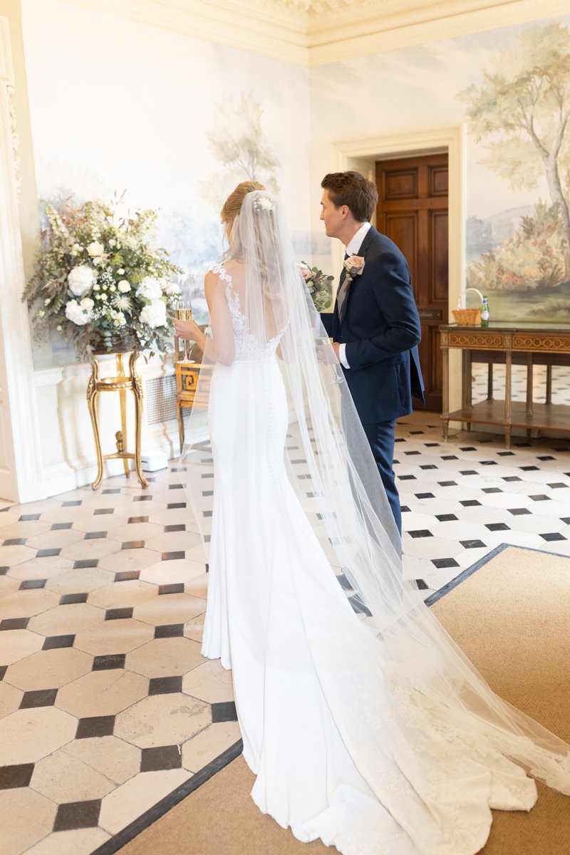 Bride and Groom walking in to Hedsor House