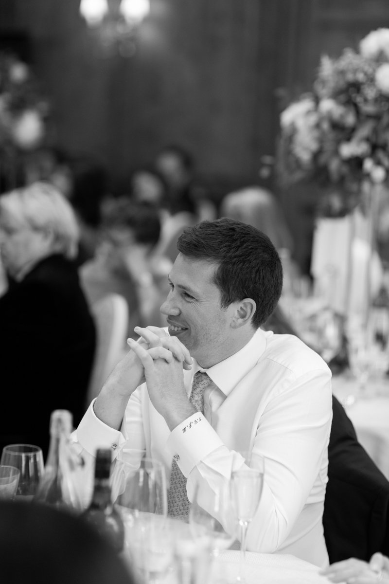 guests laughing to wedding speeches