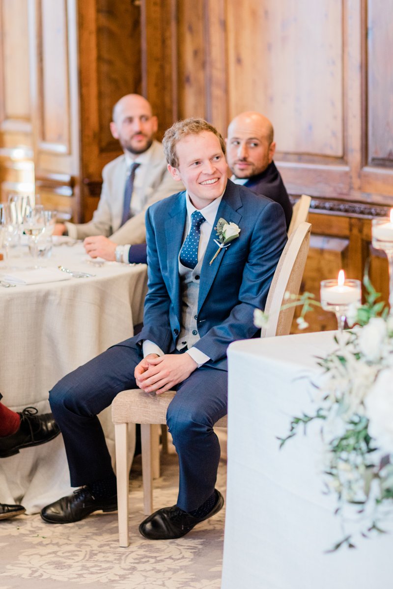 guests laughing to wedding speeches