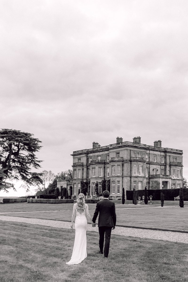 bride and grooming outside Hedsor House