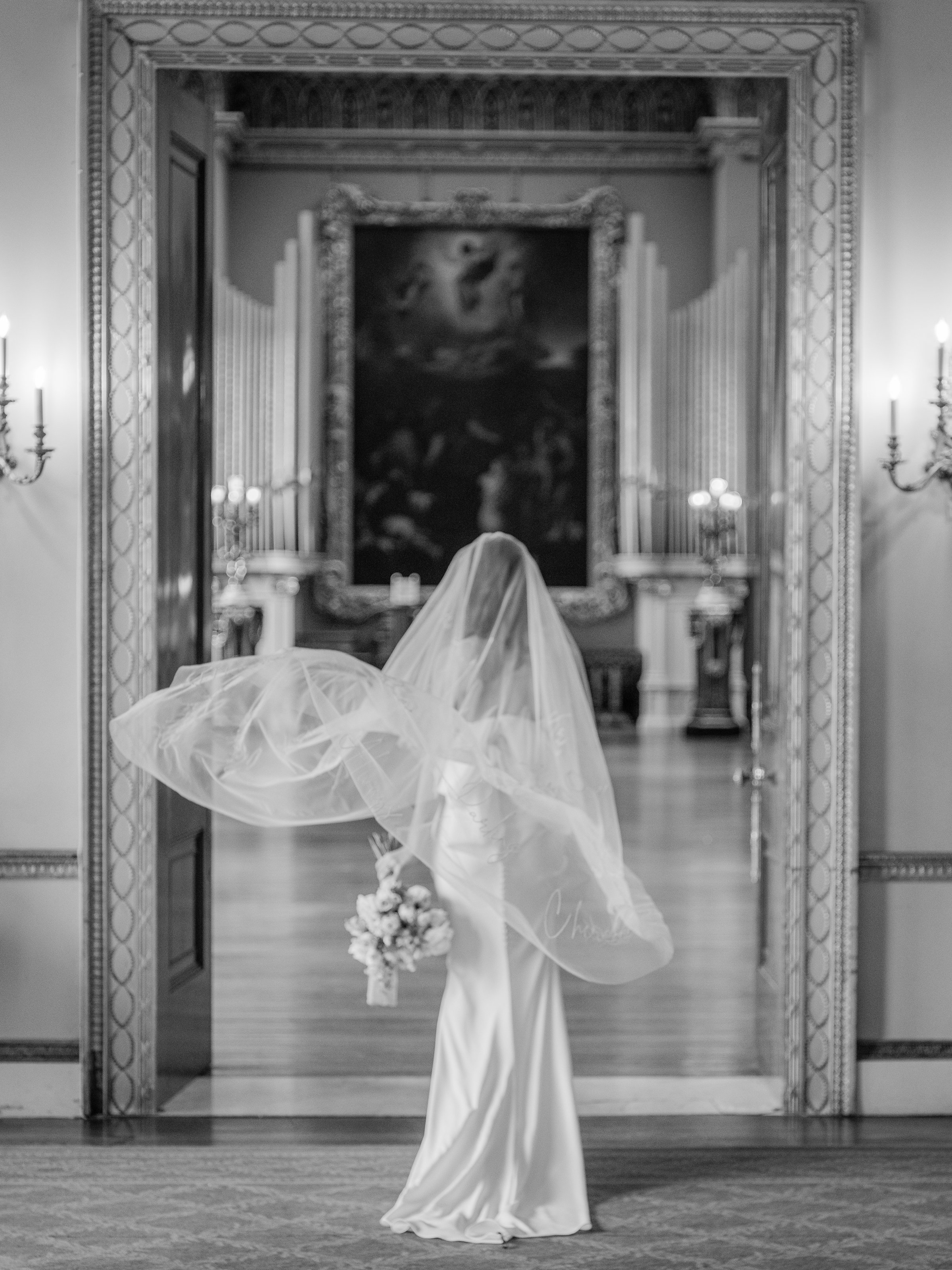 Bride walking in to a doorway at Somerley House