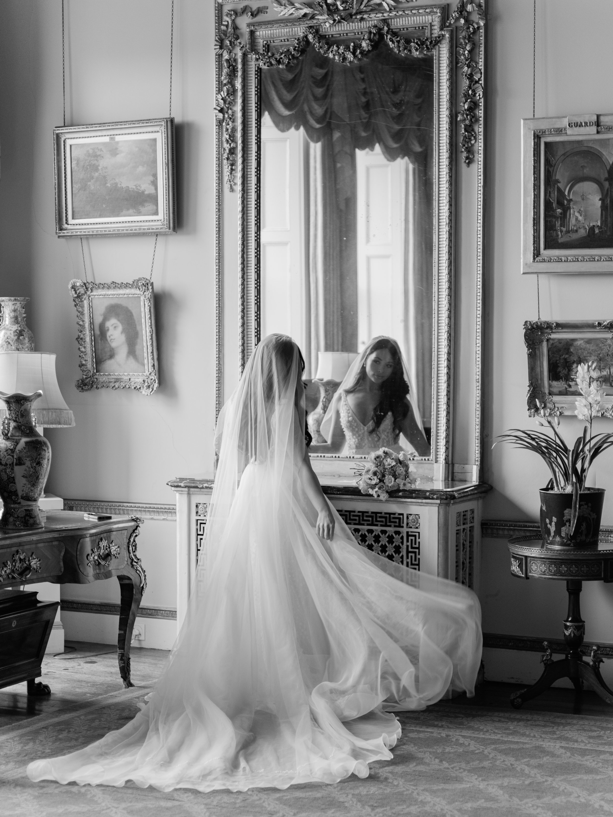 Bride looking in mirror at Somerley House