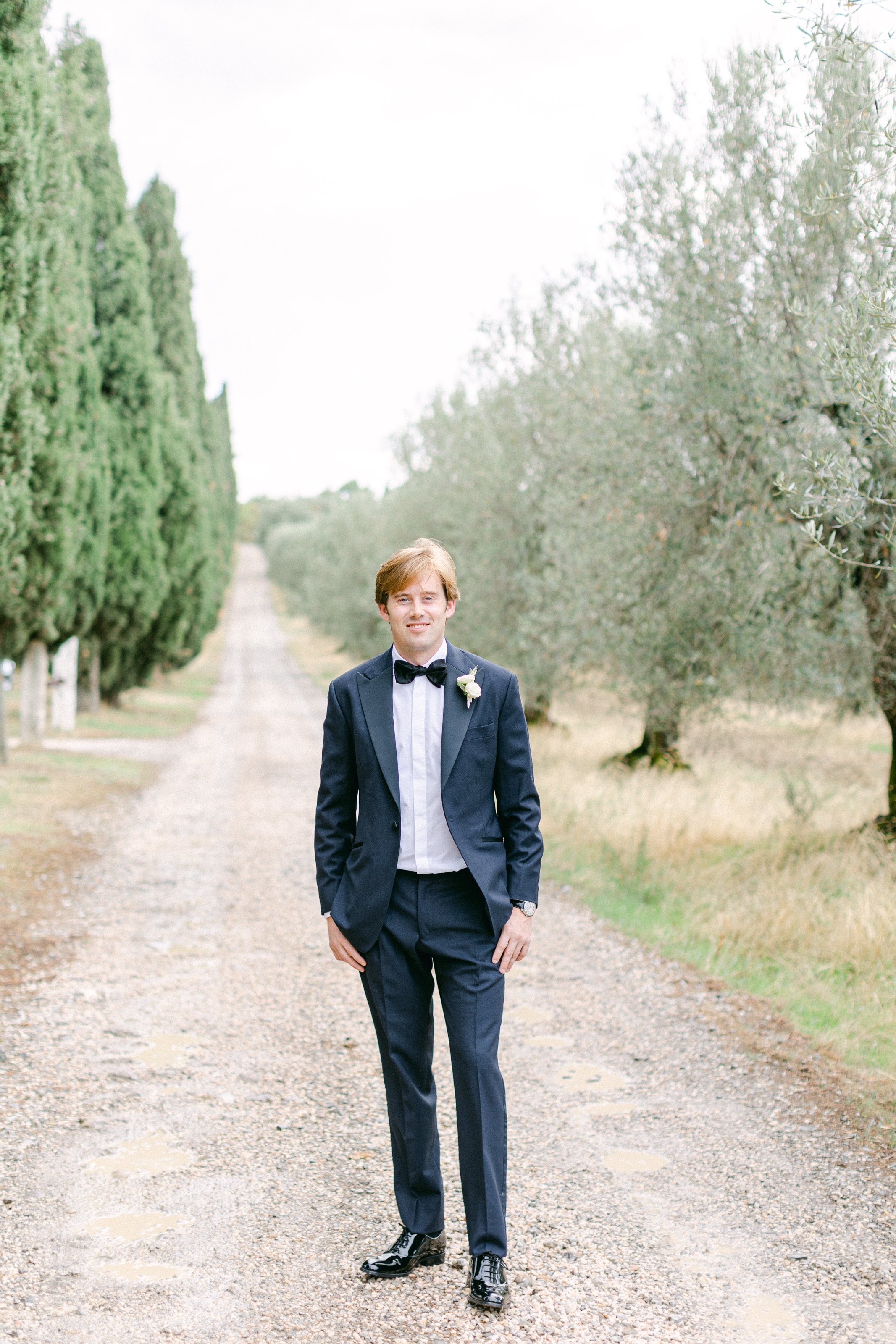 Groom outside in Tuscany waiting to be married