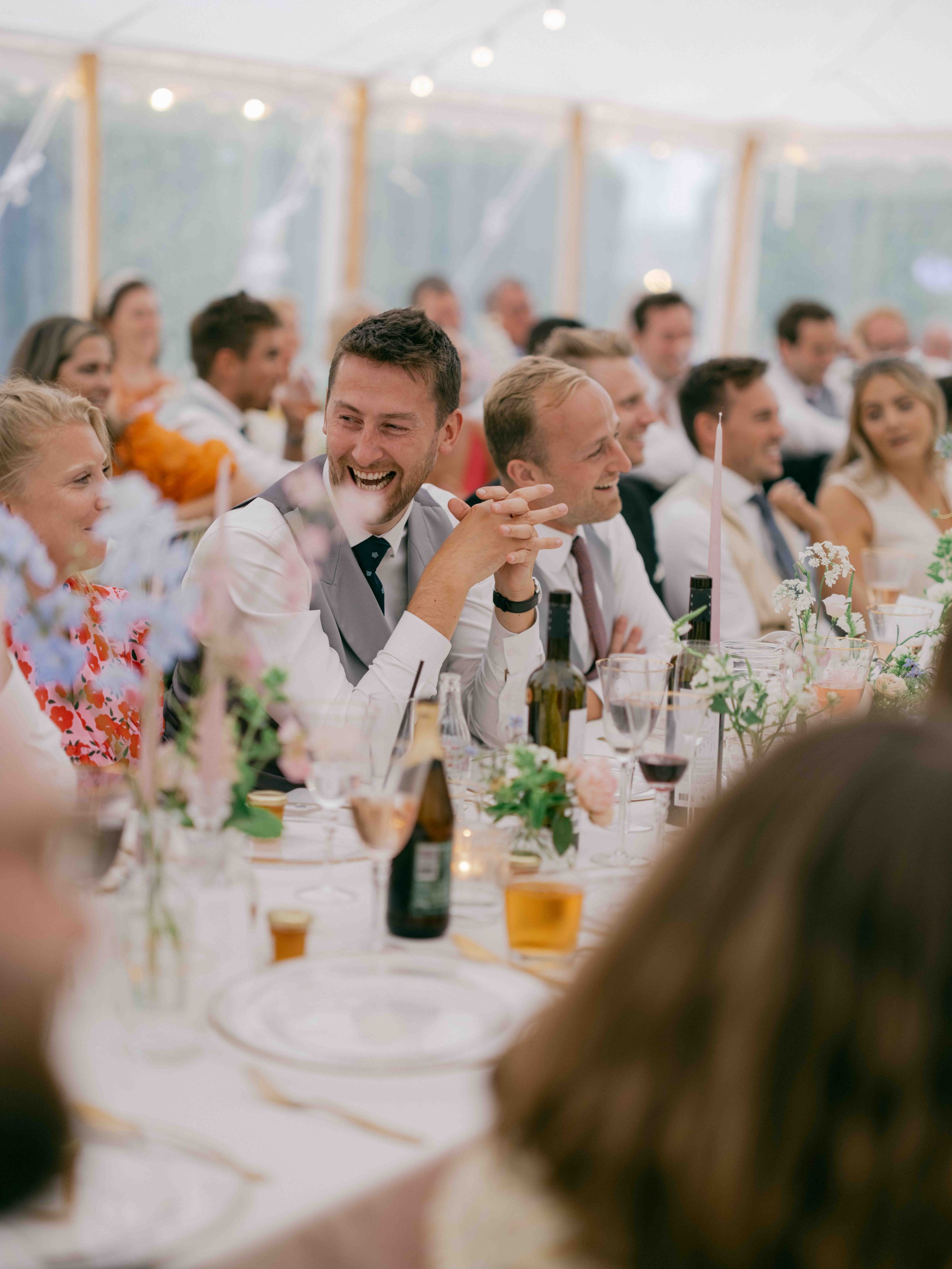  guests laughing at speeches 