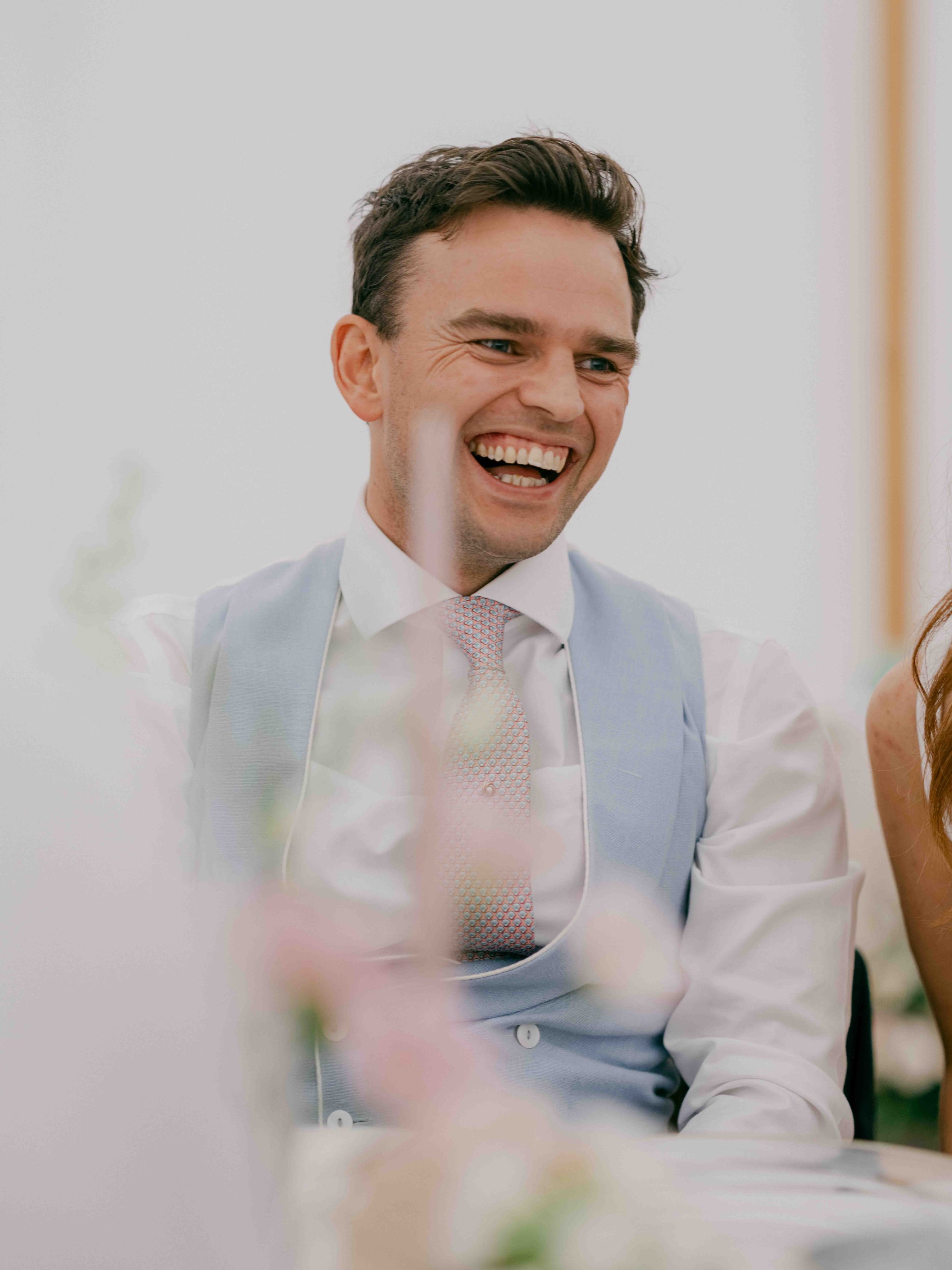  groom laughing at speeches 