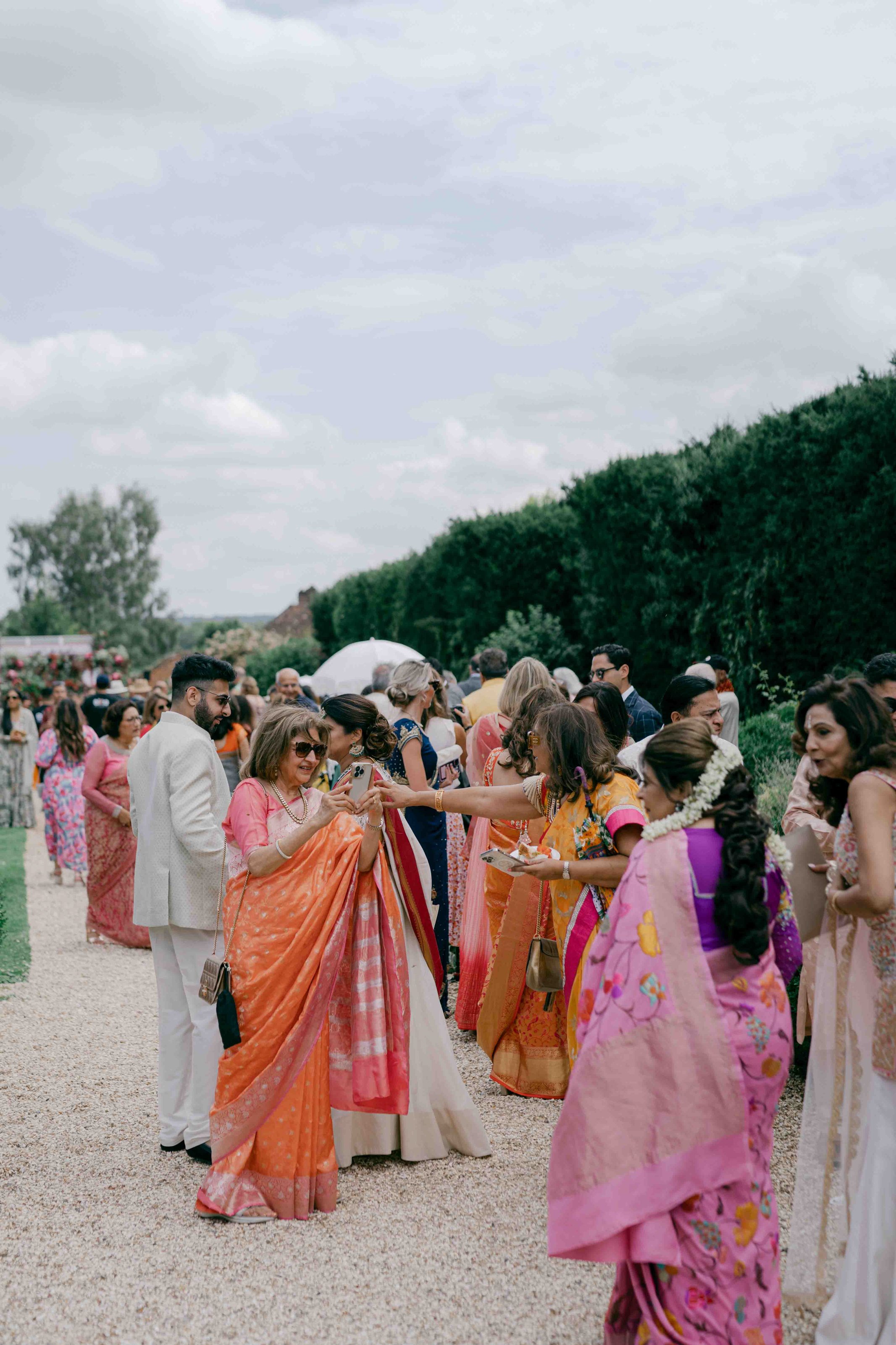  wedding guests greeting each other 