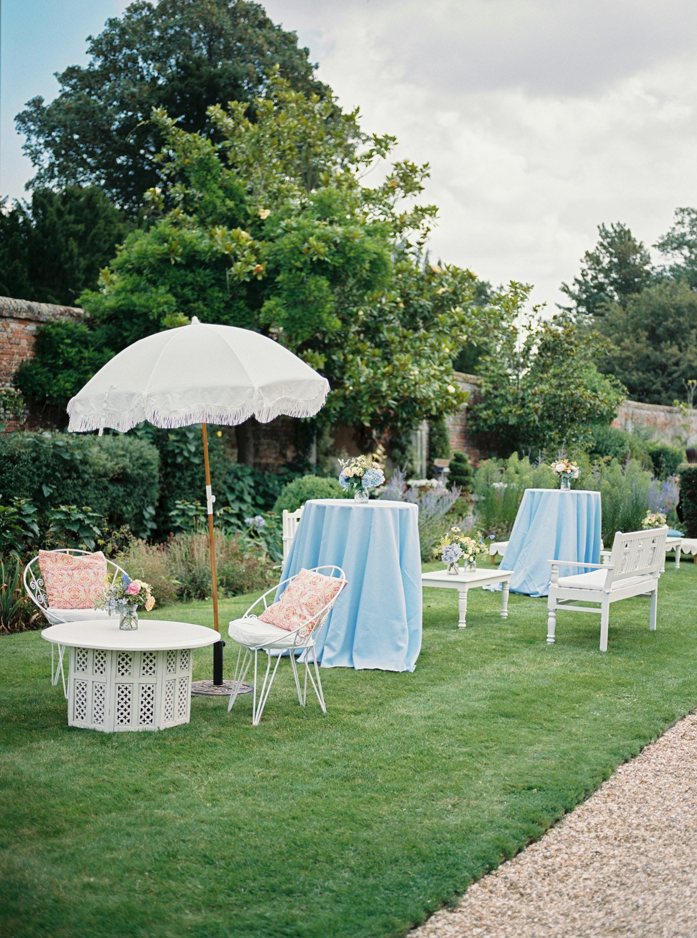  outside seating for wedding guests with parasols 