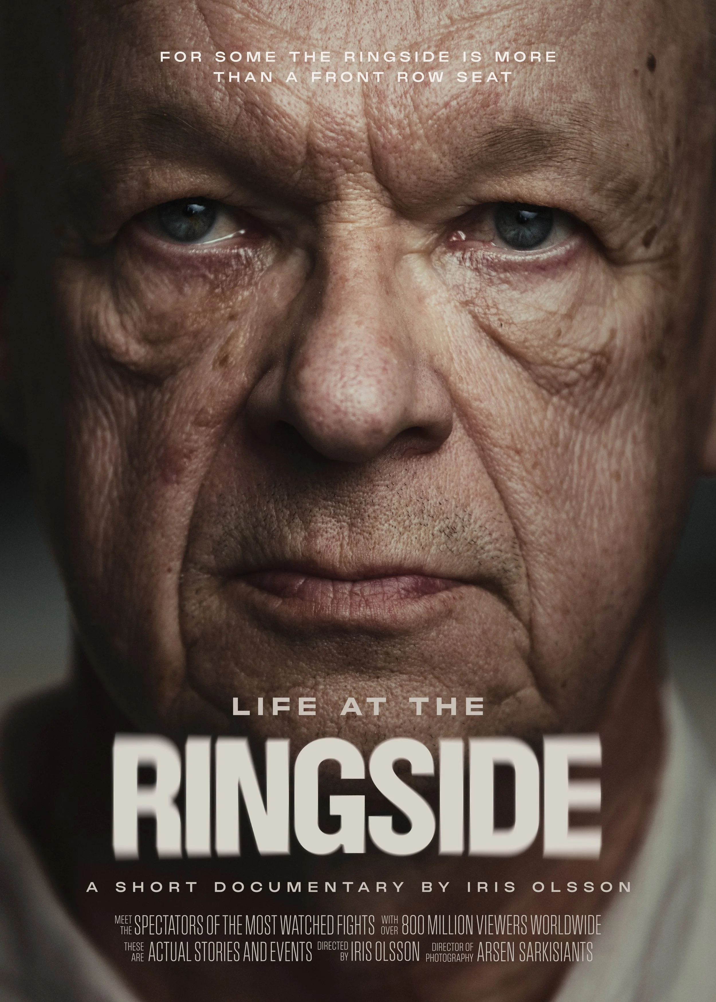 Close-up portrait of an elderly man with wrinkled skin and piercing blue eyes, staring directly at the camera, with text promoting a documentary titled "Life at the Ringside" by Iris Olsson.