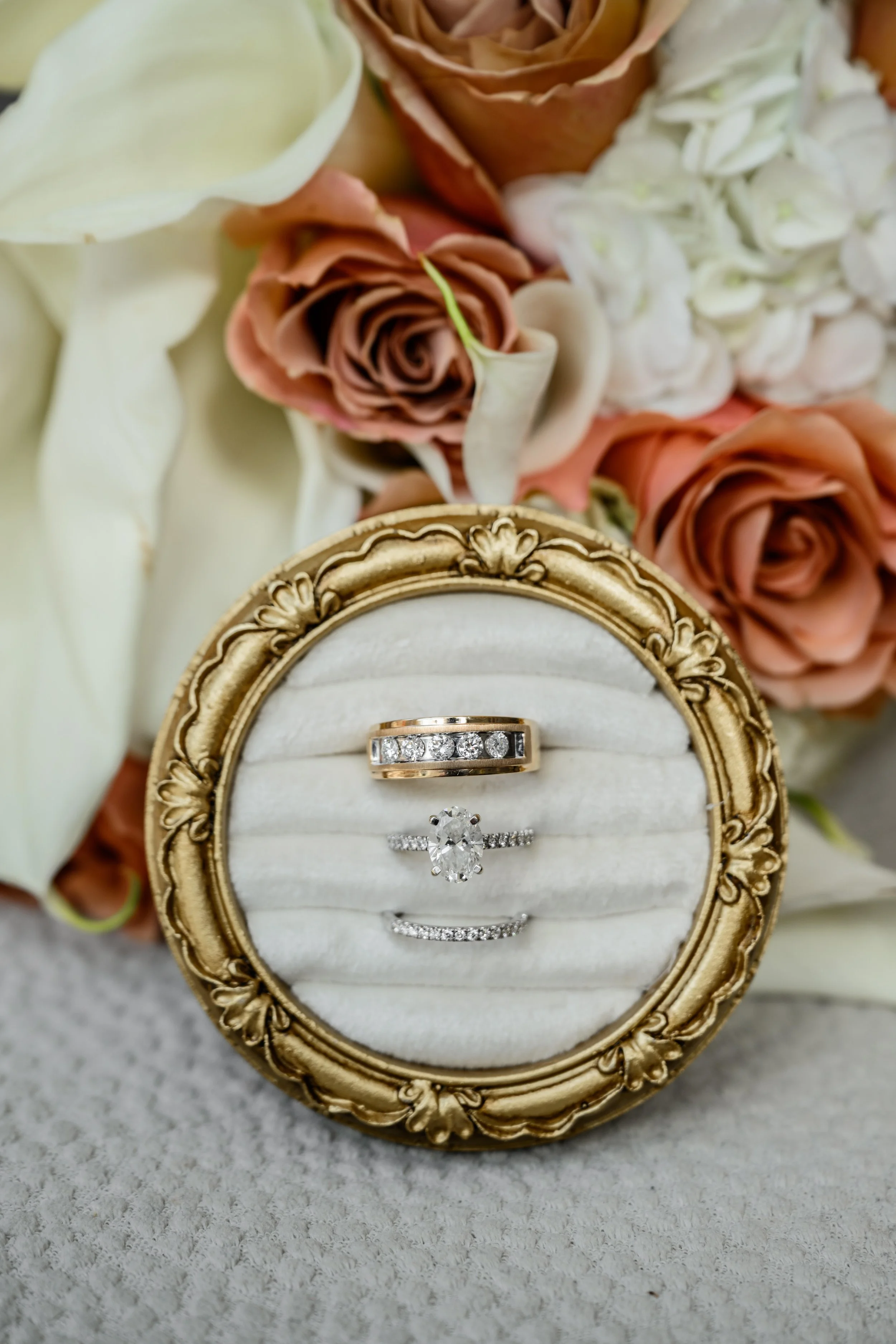 Wedding rings photographed with floral details at Georgian Hall in Athens