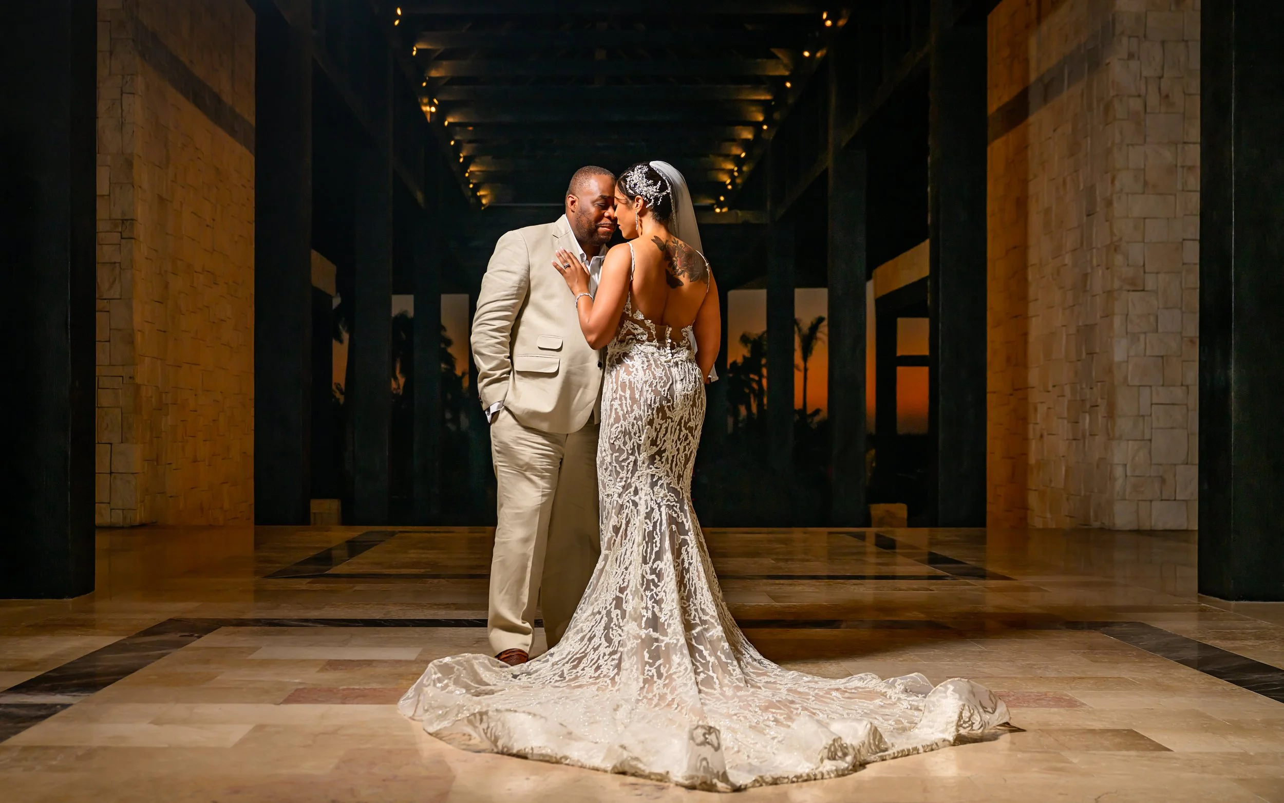 Tekla and Rick photographed together at night during their Cancun destination wedding.