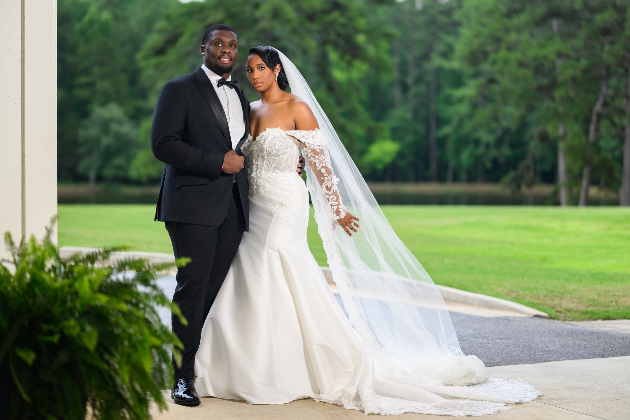 Bride and groom posing together outdoors after their wedding ceremony at The Venue at Daisy Hill.