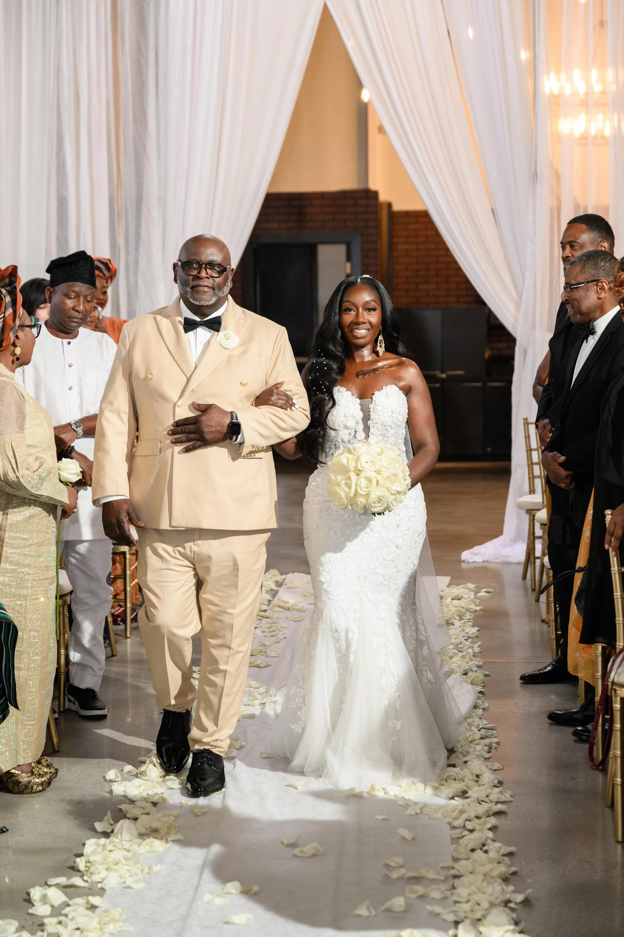 Jalisa walking down the aisle during her wedding ceremony at The West Venue