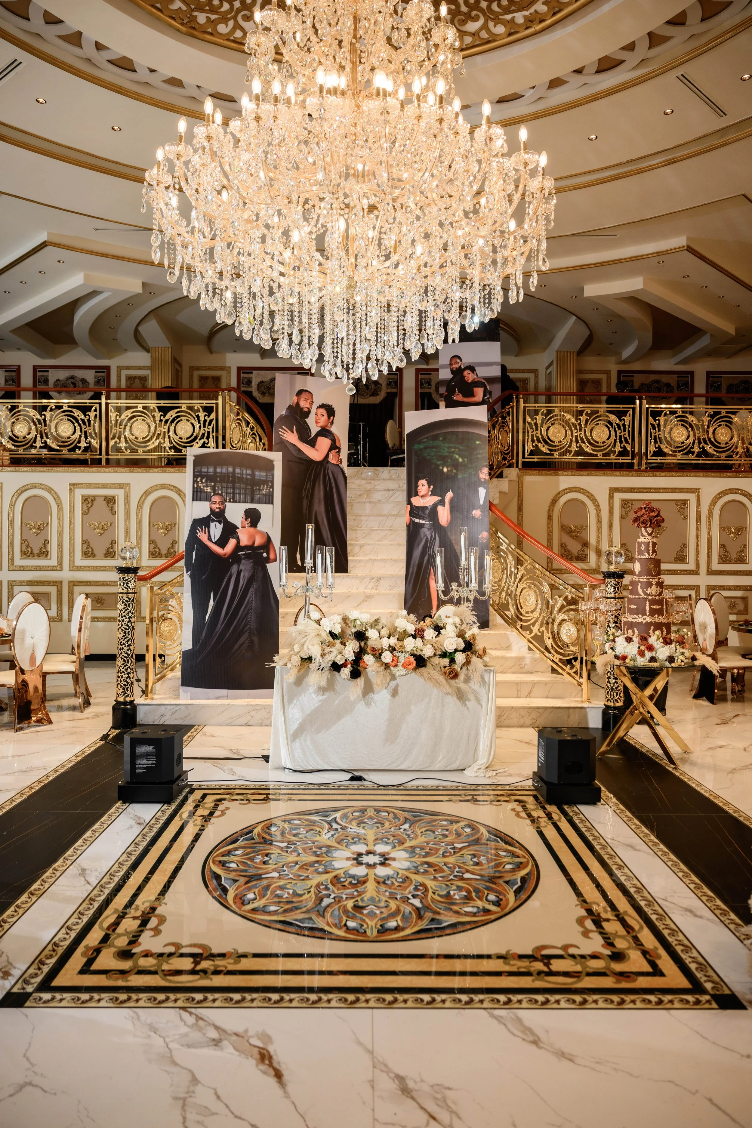 Wedding reception setup with crystal chandeliers, gold details and floral decor at Shahbain Events Center in North Carolina.