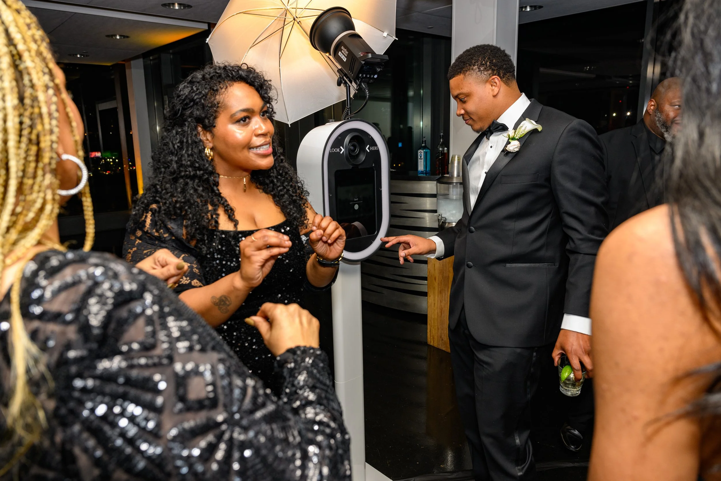 Wedding guests enjoying The Artis Touch Photo Booth experience at an Atlanta wedding.