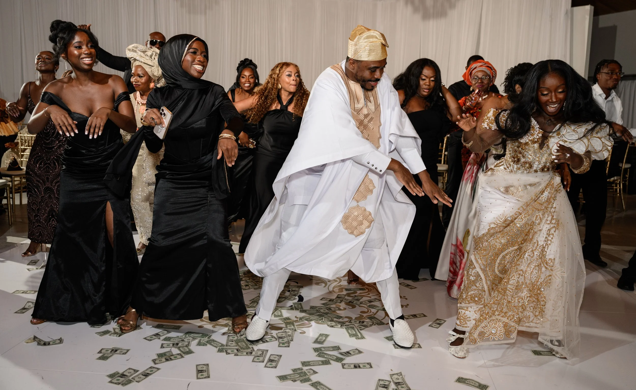 Jalisa and Sadiq celebrating on the dance floor with their wedding guests