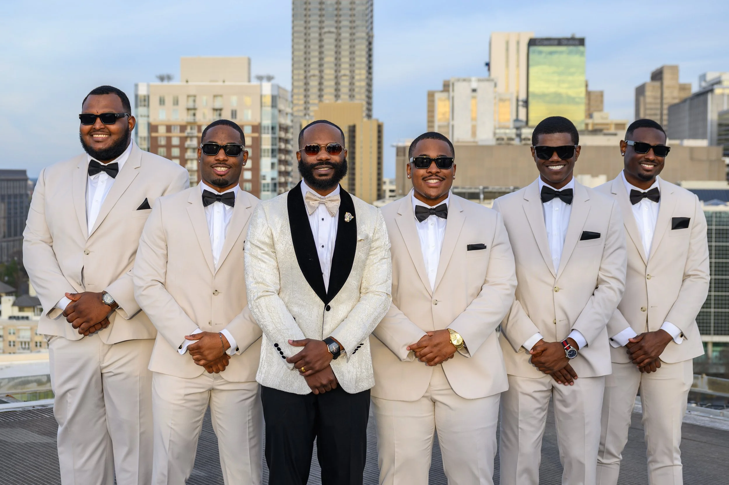 Groom with his groomsmen overlooking the Atlanta skyline at Ventanas.