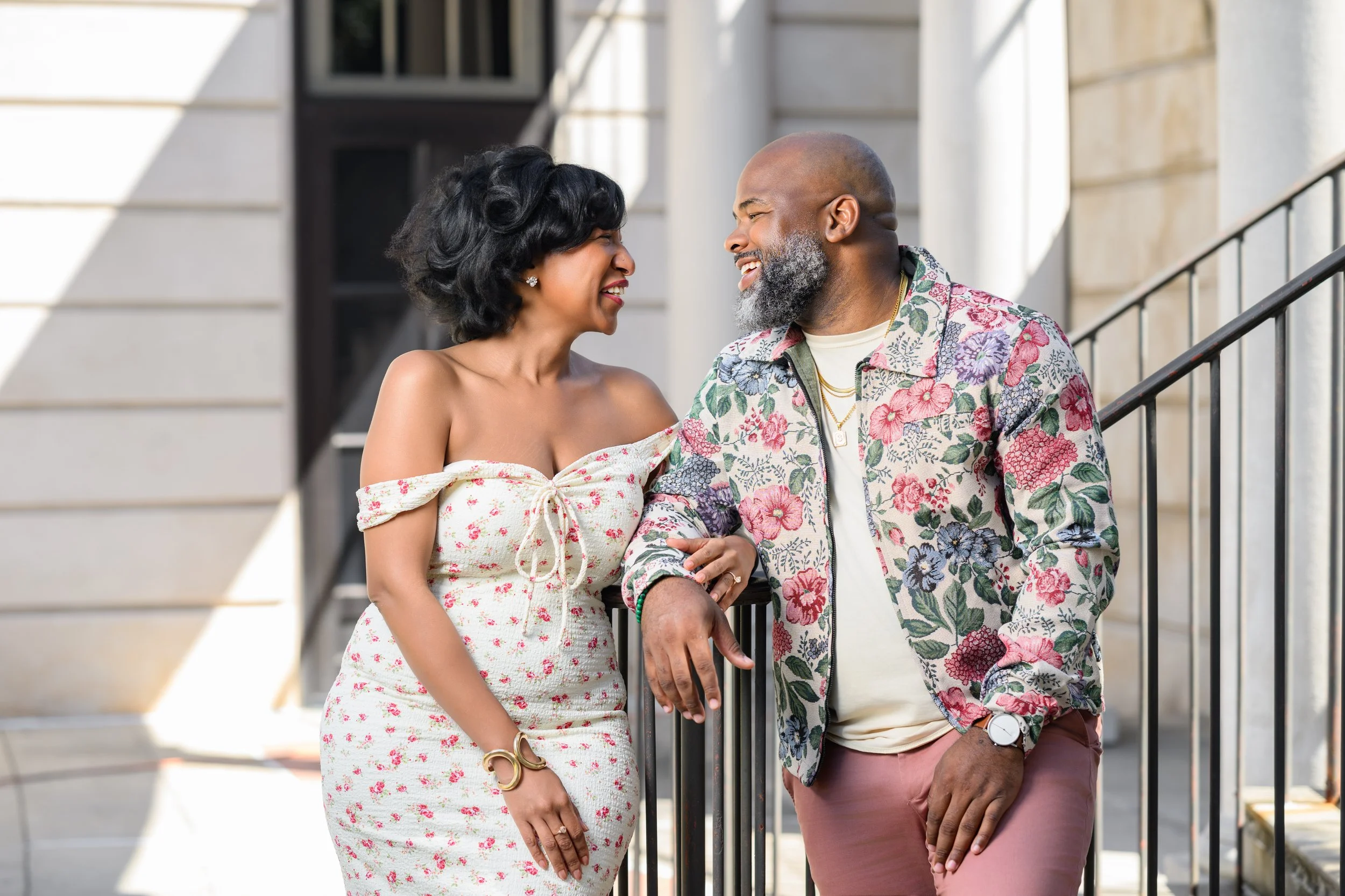 Jessica and Steven laughing together during their engagement photos in Atlanta.