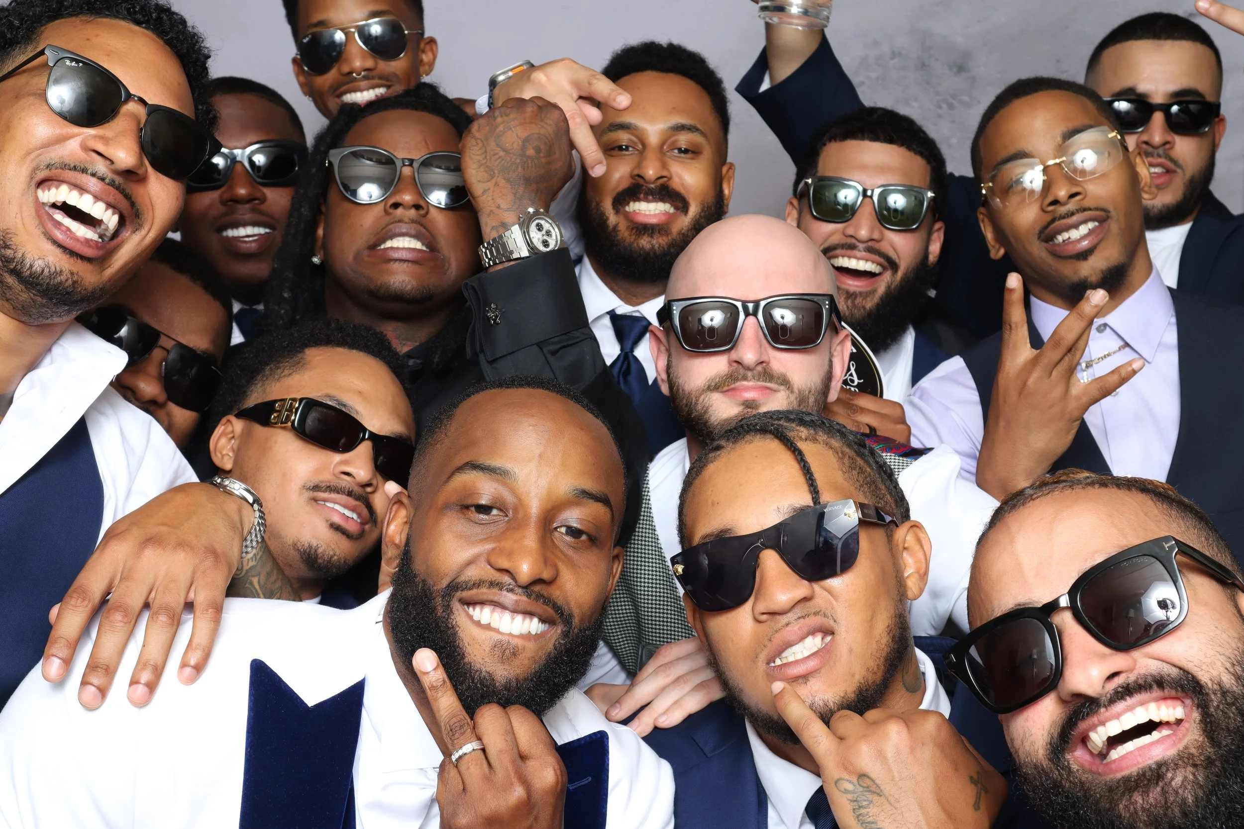 Large group of wedding guests having fun together in an Atlanta photo booth by The Artis Touch Photo Booth.