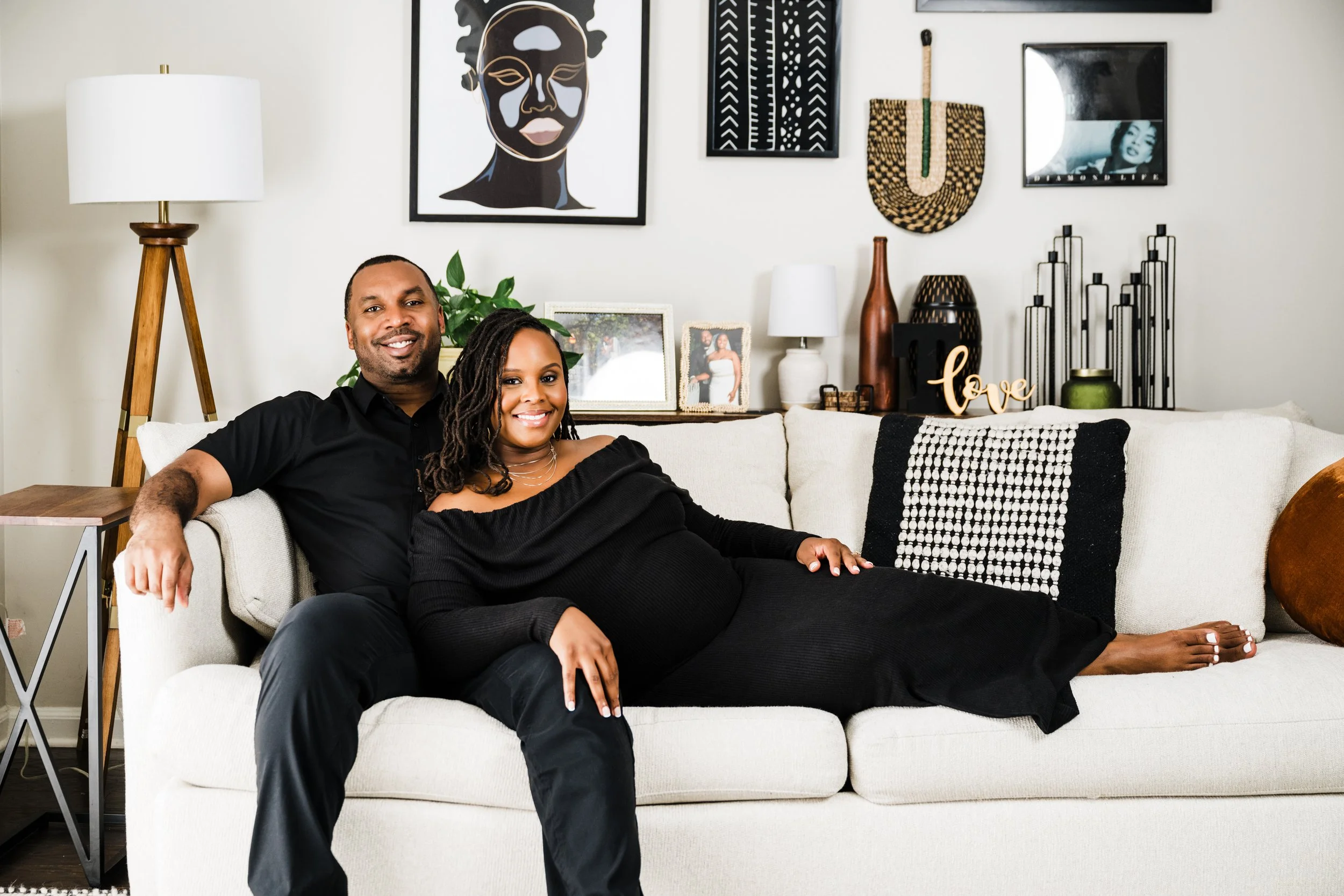 Expecting couple during an in-home lifestyle maternity photography session in the Atlanta area by Crystal Artis Photography.
