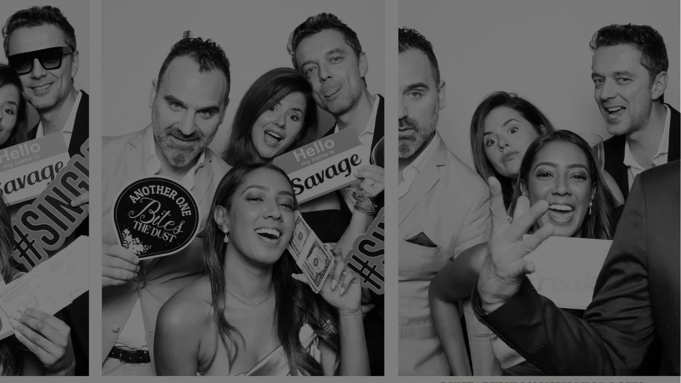 wedding guests enjoying a glam black and white photo booth experience in Atlanta.