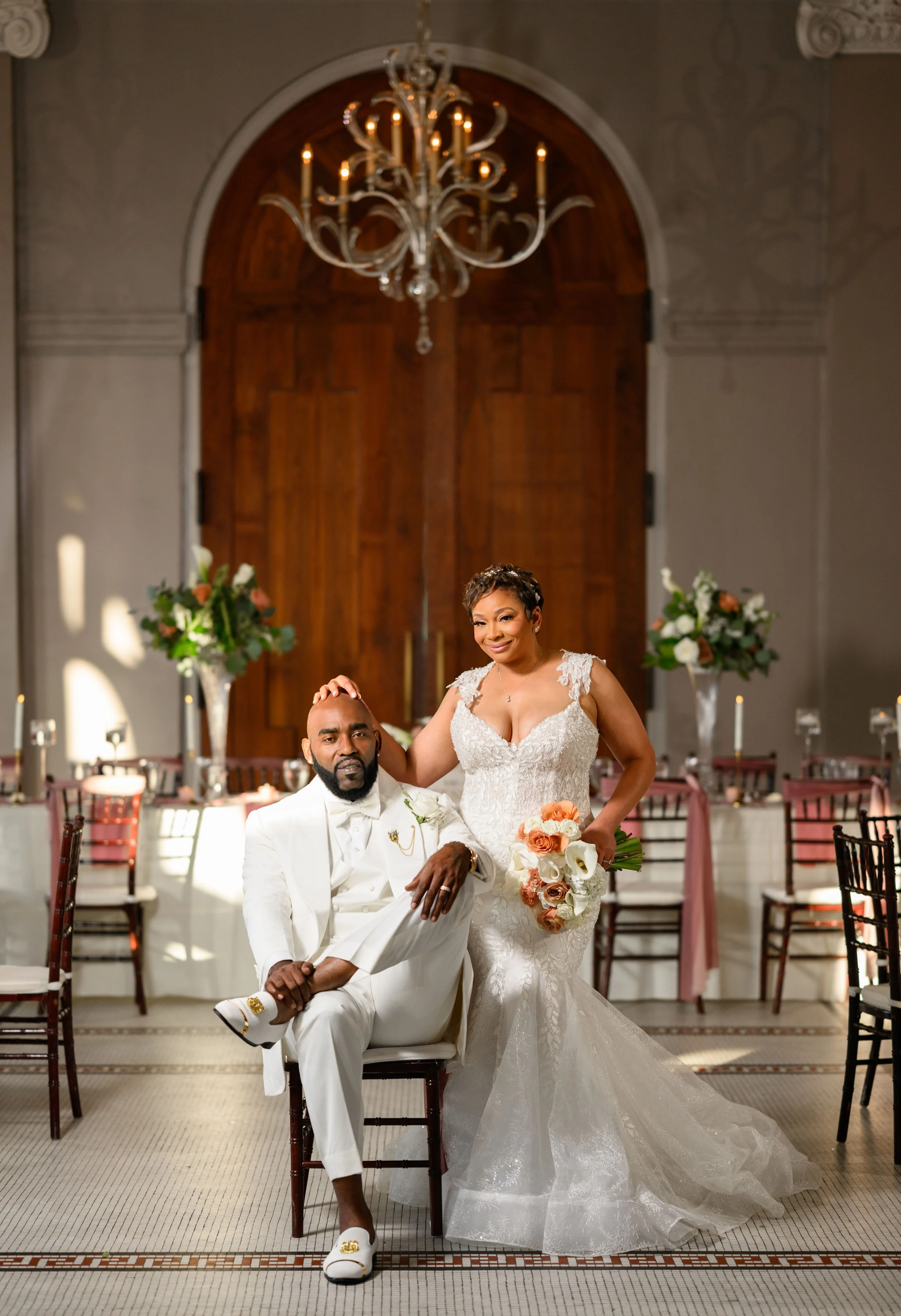 Bride and groom posing for a wedding portrait inside Georgian Hall.