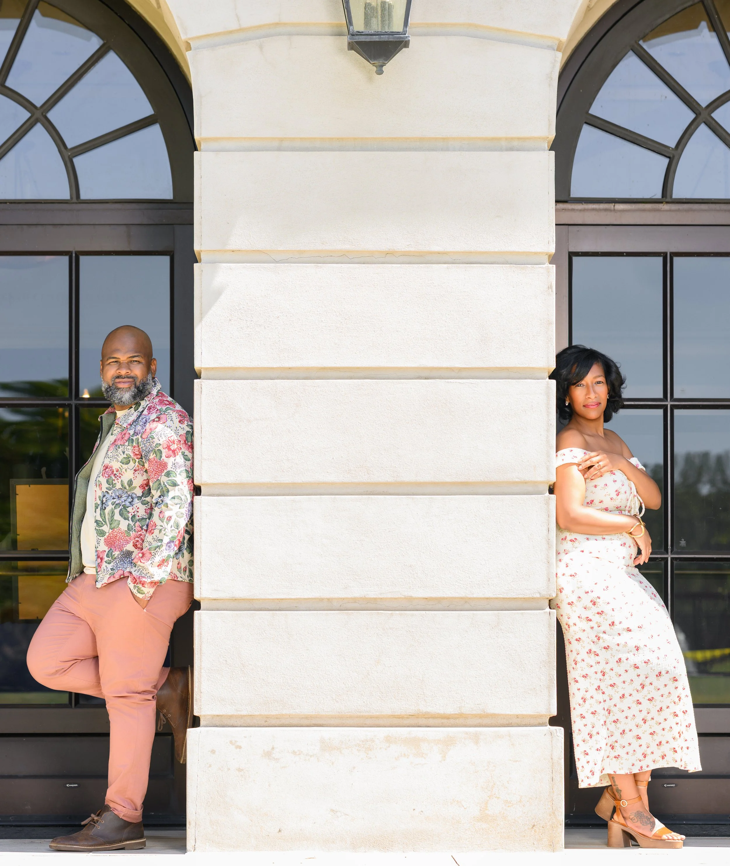 Creative engagement portrait of Jessica and Steven framed by the architecture at Millennium Gate Museum.