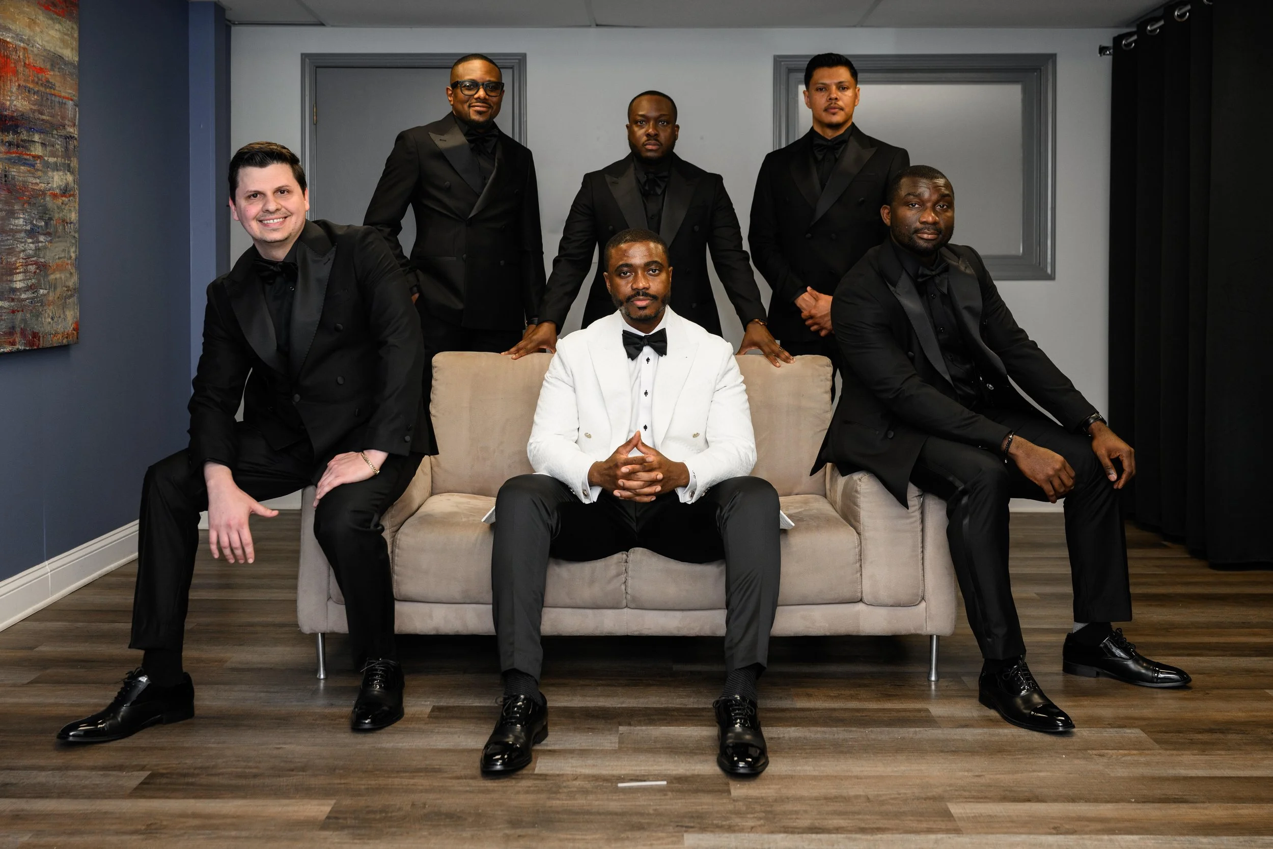 Sadiq posing with his groomsmen before the wedding ceremony