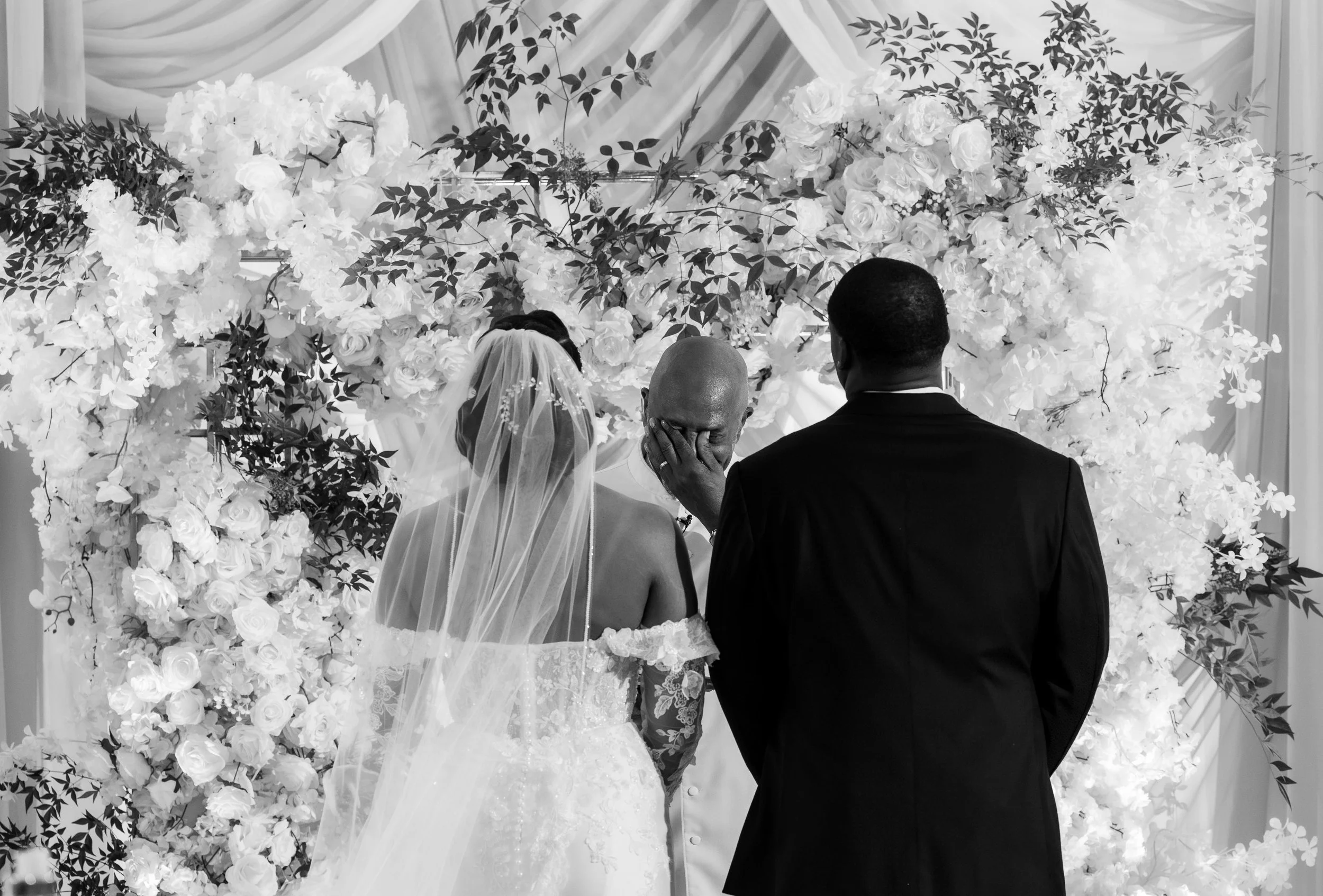 Emotional moment during the wedding ceremony as the officiant wipes away tears at The Venue at Daisy Hill.