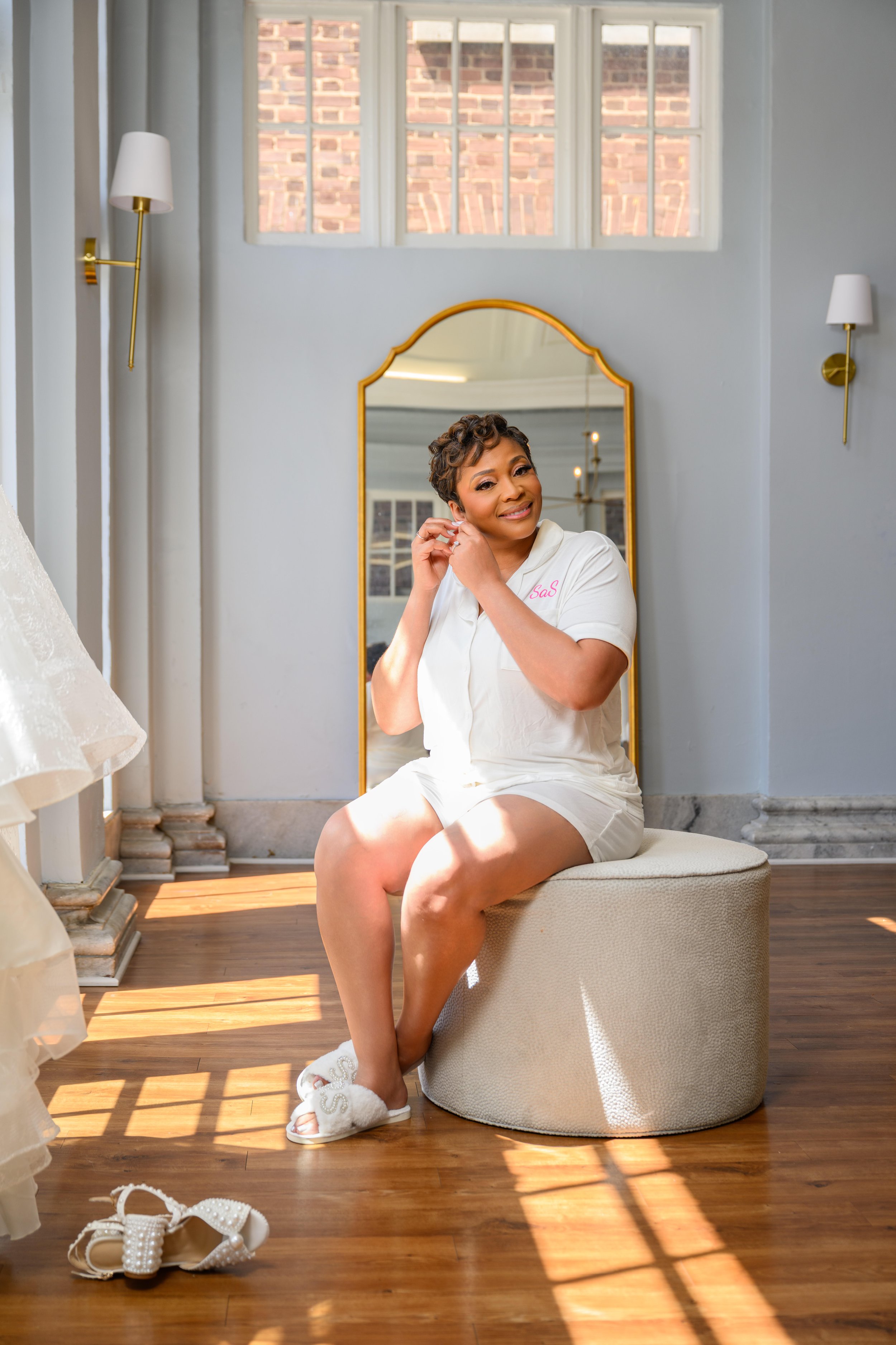 Bride photographed in beautiful window light on her wedding day at Georgian Hall.