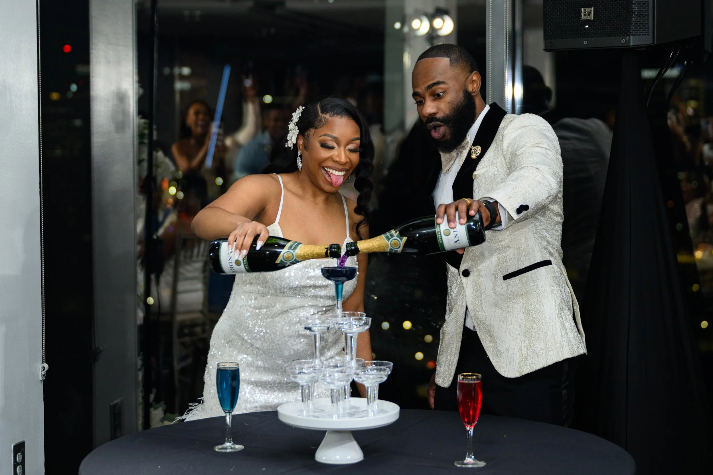 Newlyweds Shareze and Jacorey celebrating their baby gender reveal during their Atlanta wedding reception.