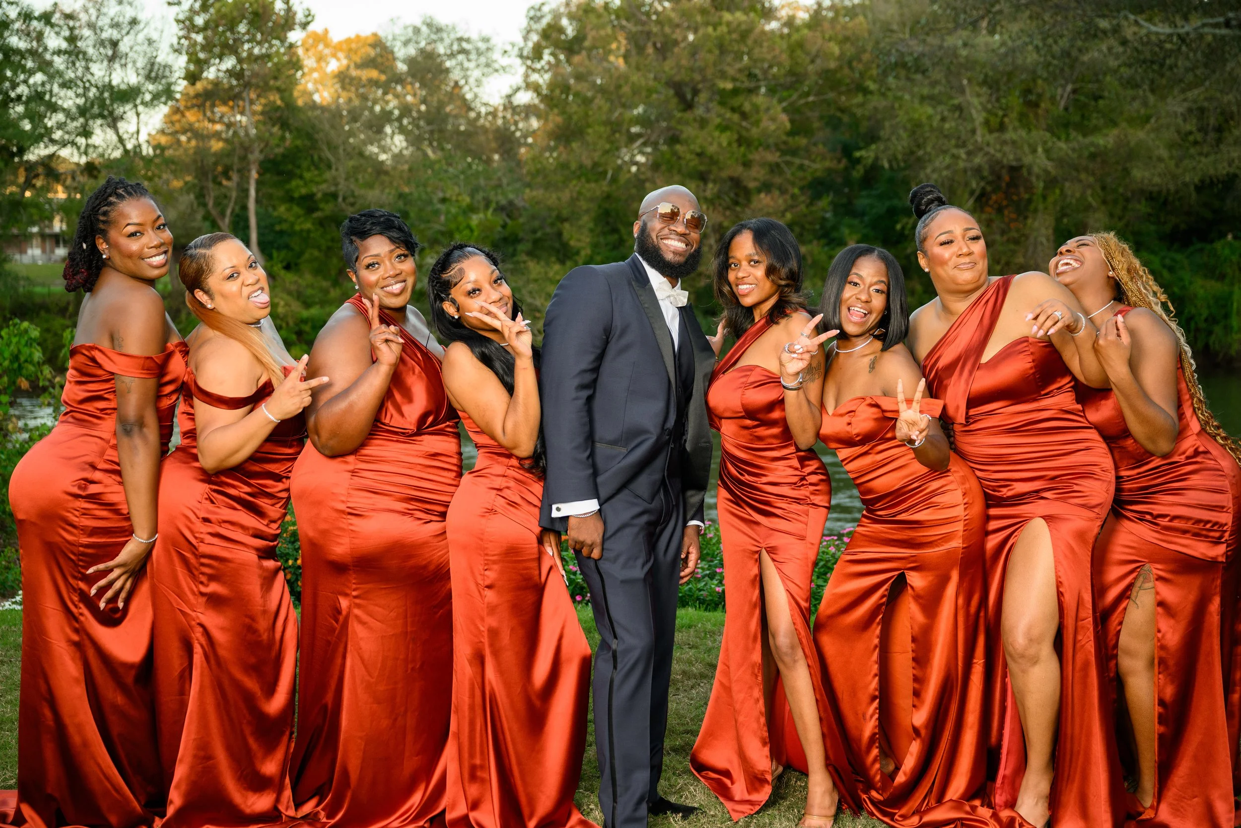 Joyful bridal party posing together during an intimate fall wedding celebration at Canoe Restaurant in Atlanta.