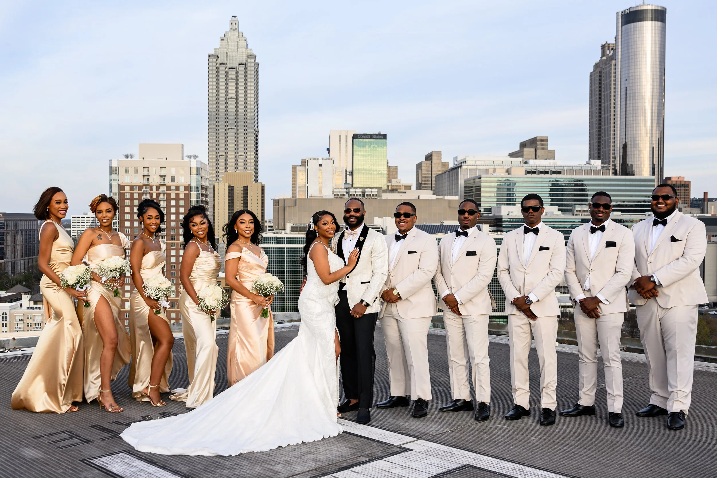 Shareze and Jacorey with their wedding party on the rooftop at Ventanas in Atlanta.