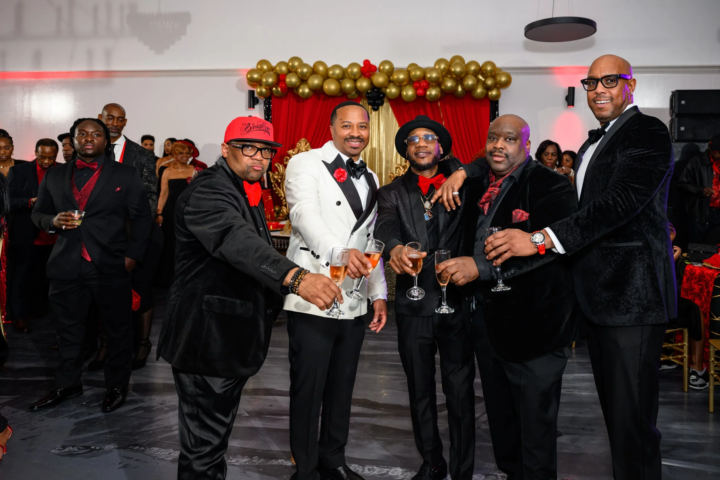 Warren raising a glass with friends during his 50th birthday celebration in Atlanta.